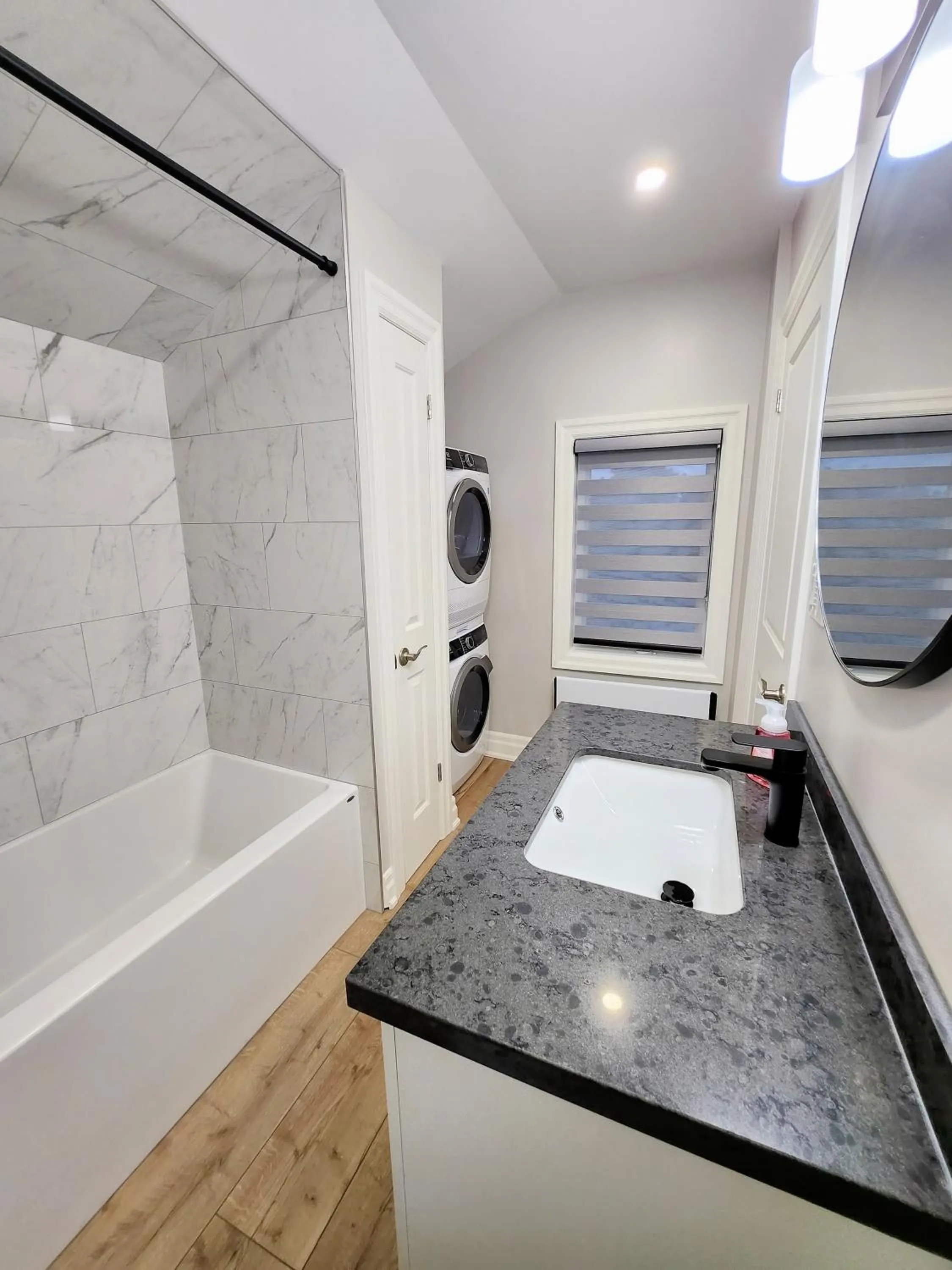 Bathroom in The Cozy Cove Modern King-Bedroom Full Apartment