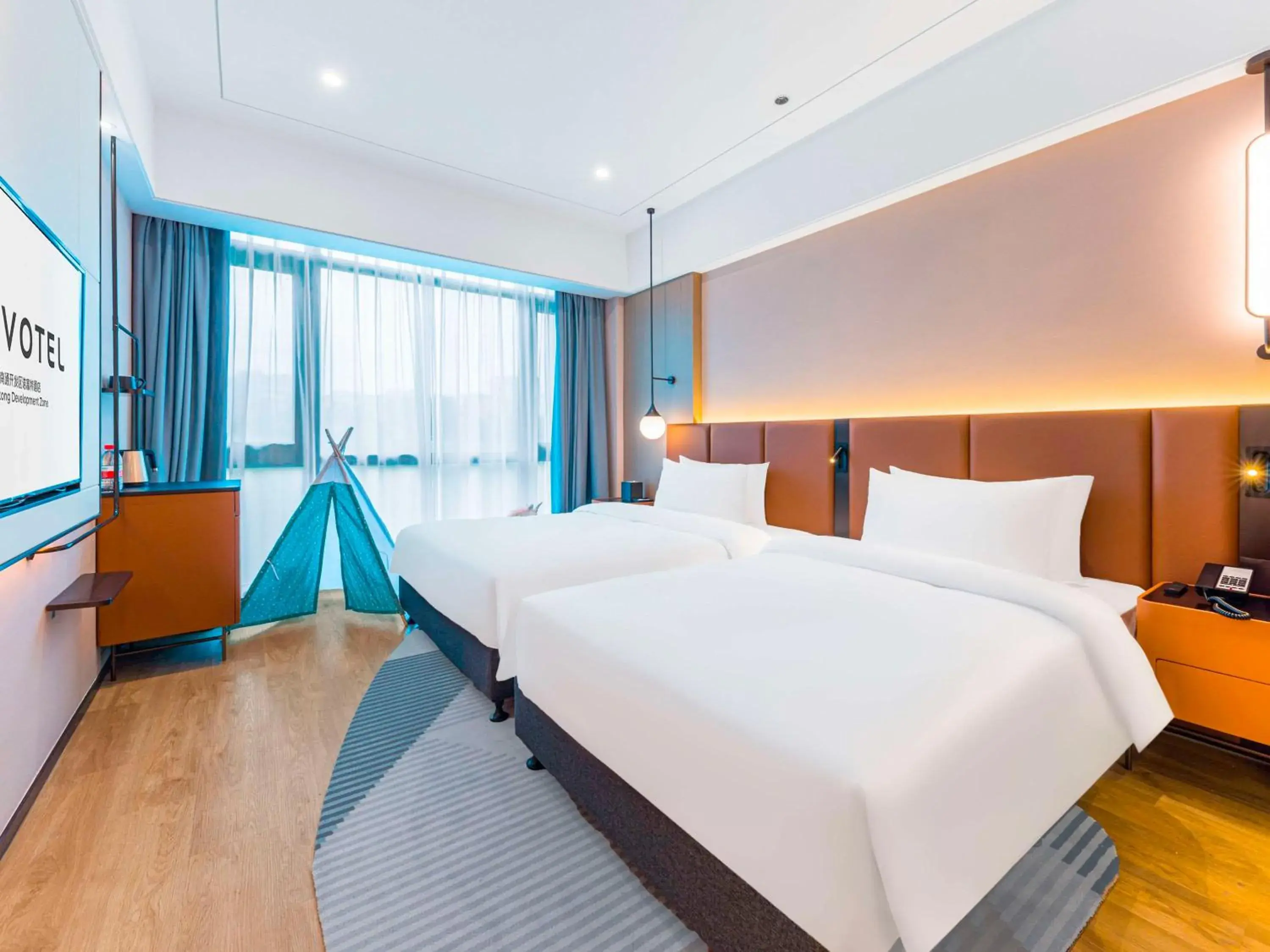 Superior Family Room with One King Bed and One Single Bed in Novotel Nantong Development Zone Superior Family Room with One King Bed and One Single Bed in Novotel Nantong Development Zone