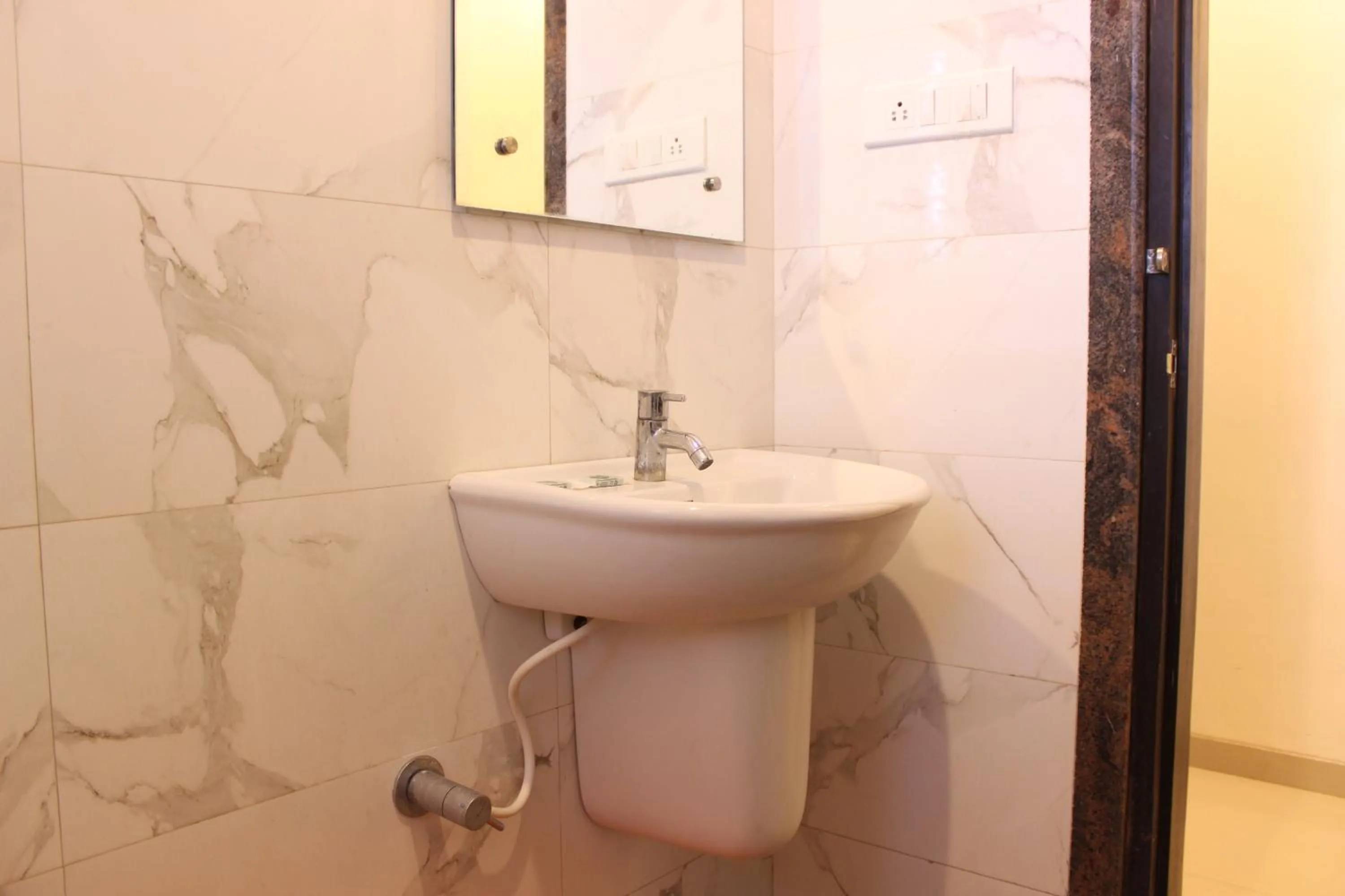 Bathroom in Hotel Sai Ramanand