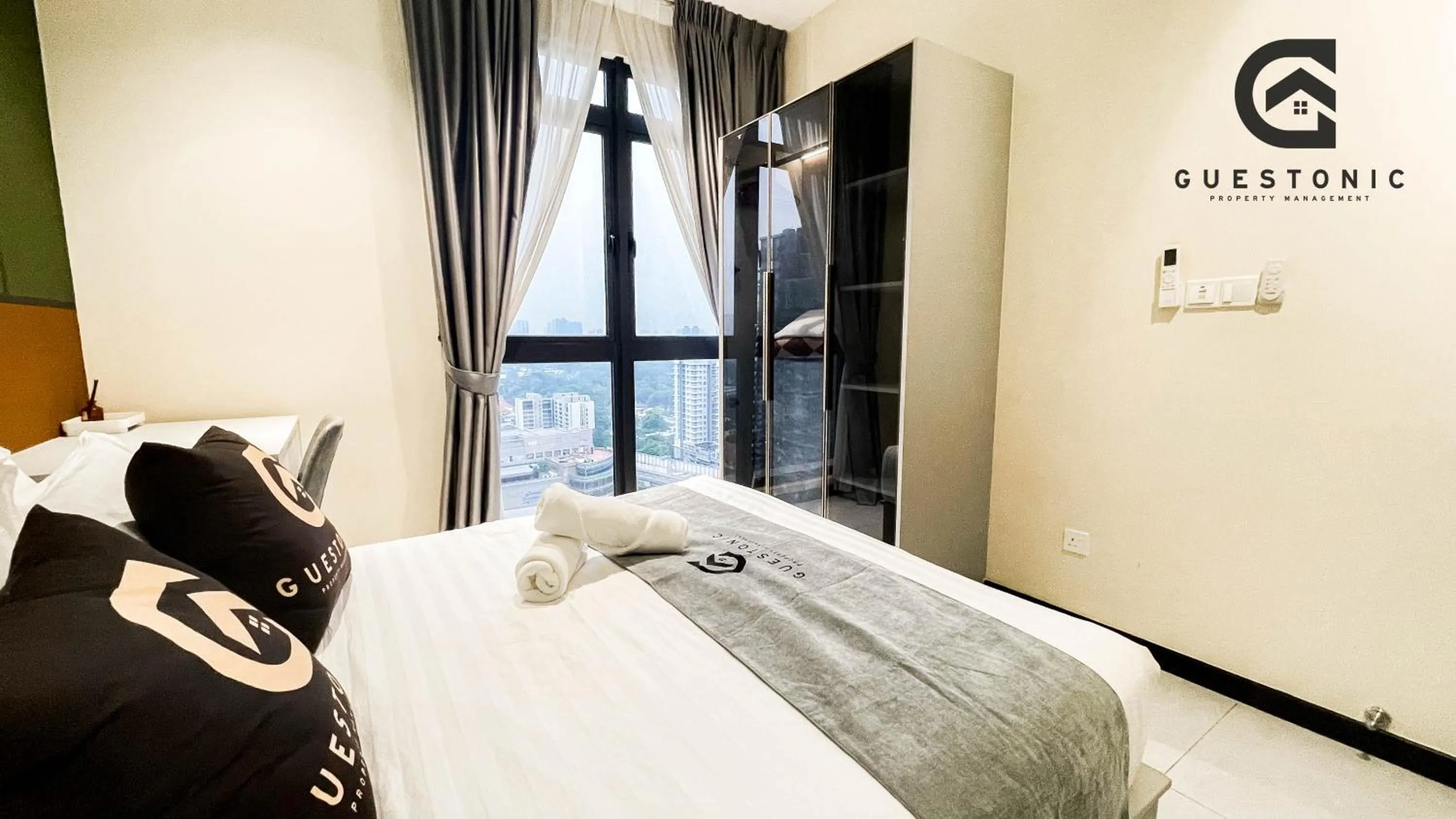 Bed in NeuSuite Cozy Studio by GUESTONIC