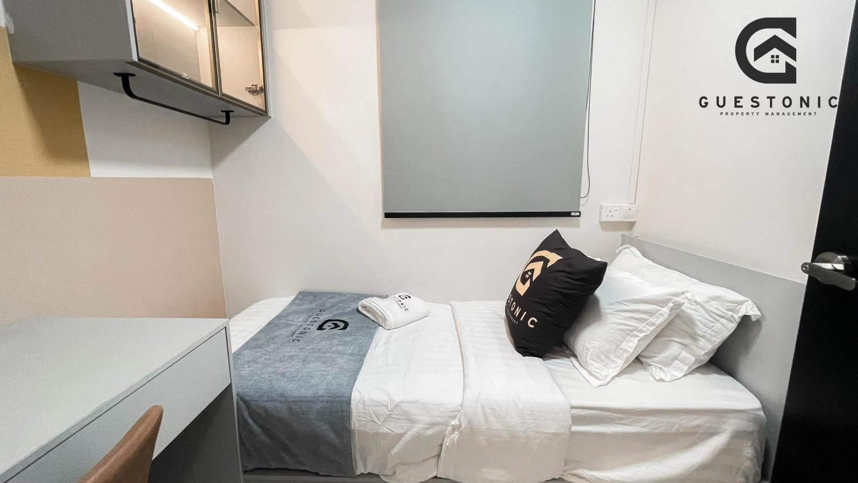 Bed in NeuSuite Cozy Studio by GUESTONIC