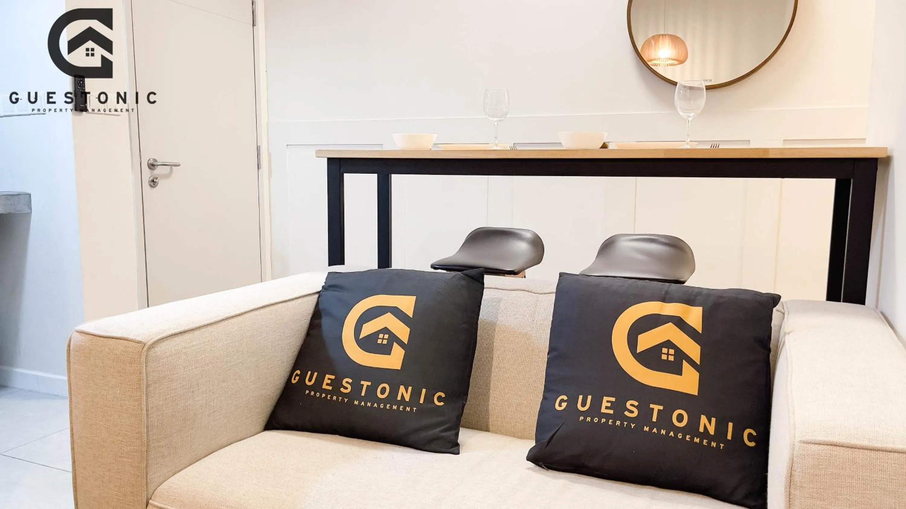 Bed in NeuSuite Cozy Studio by GUESTONIC