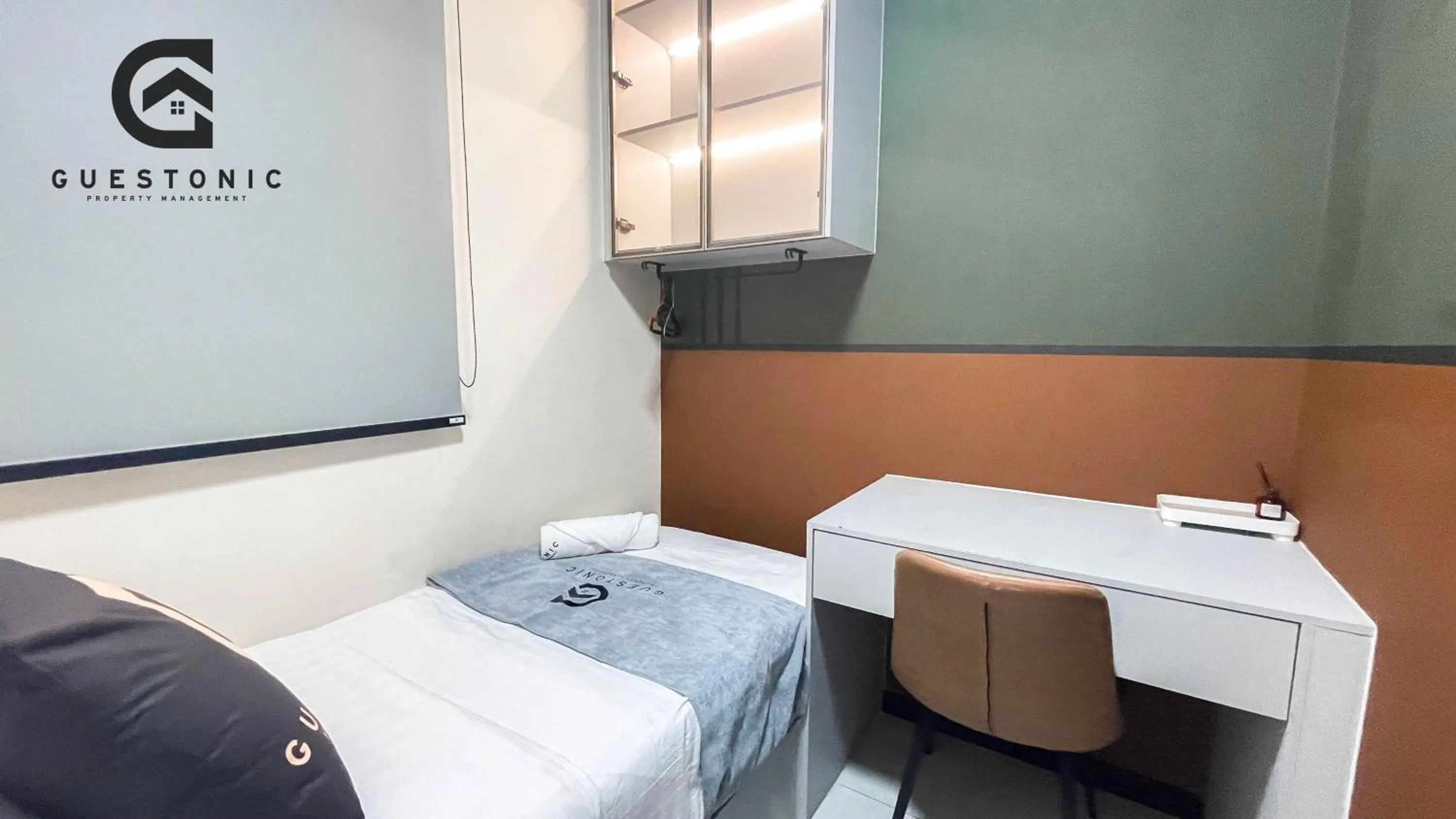 Bed in NeuSuite Cozy Studio by GUESTONIC