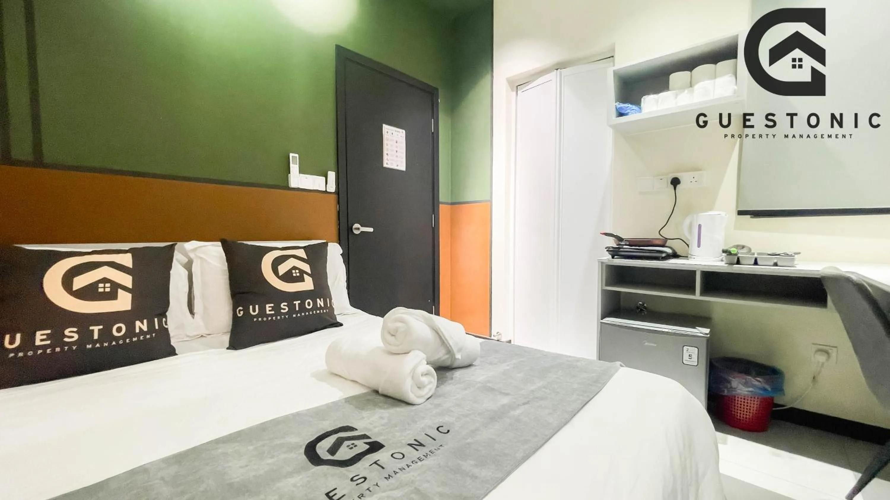 Bed in NeuSuite Cozy Studio by GUESTONIC