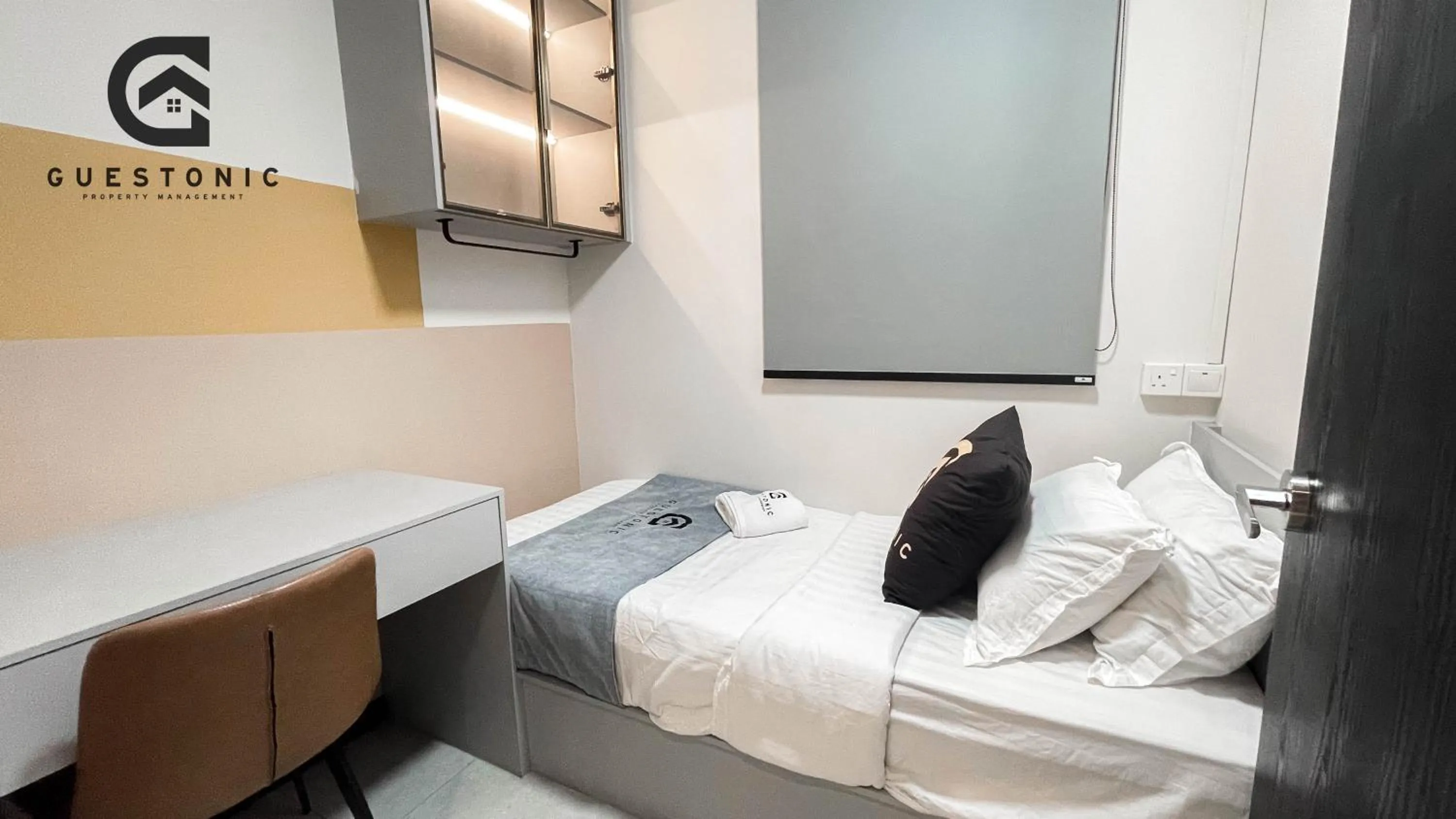 Bed in NeuSuite Cozy Studio by GUESTONIC