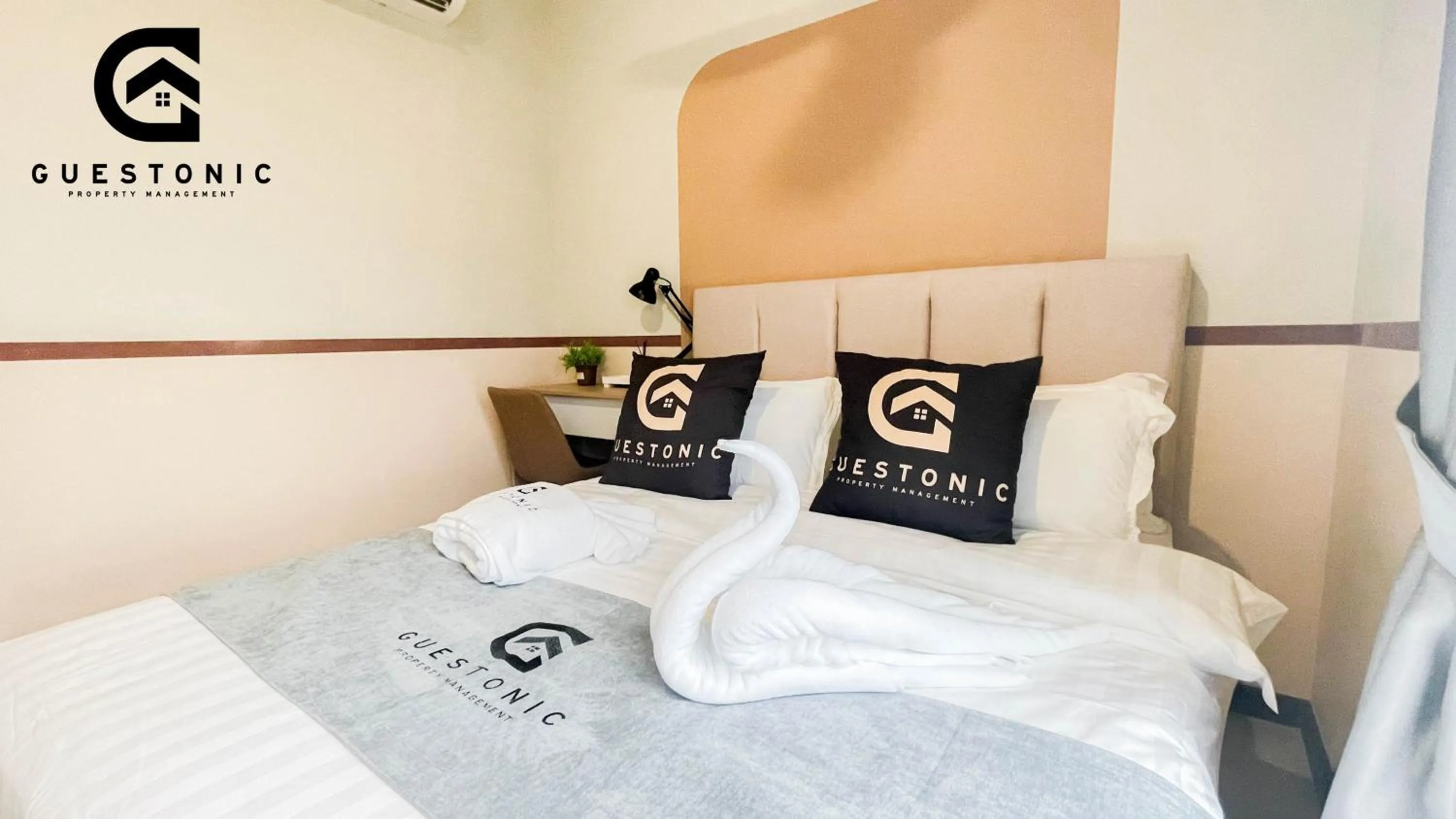 Bed in NeuSuite Cozy Studio by GUESTONIC