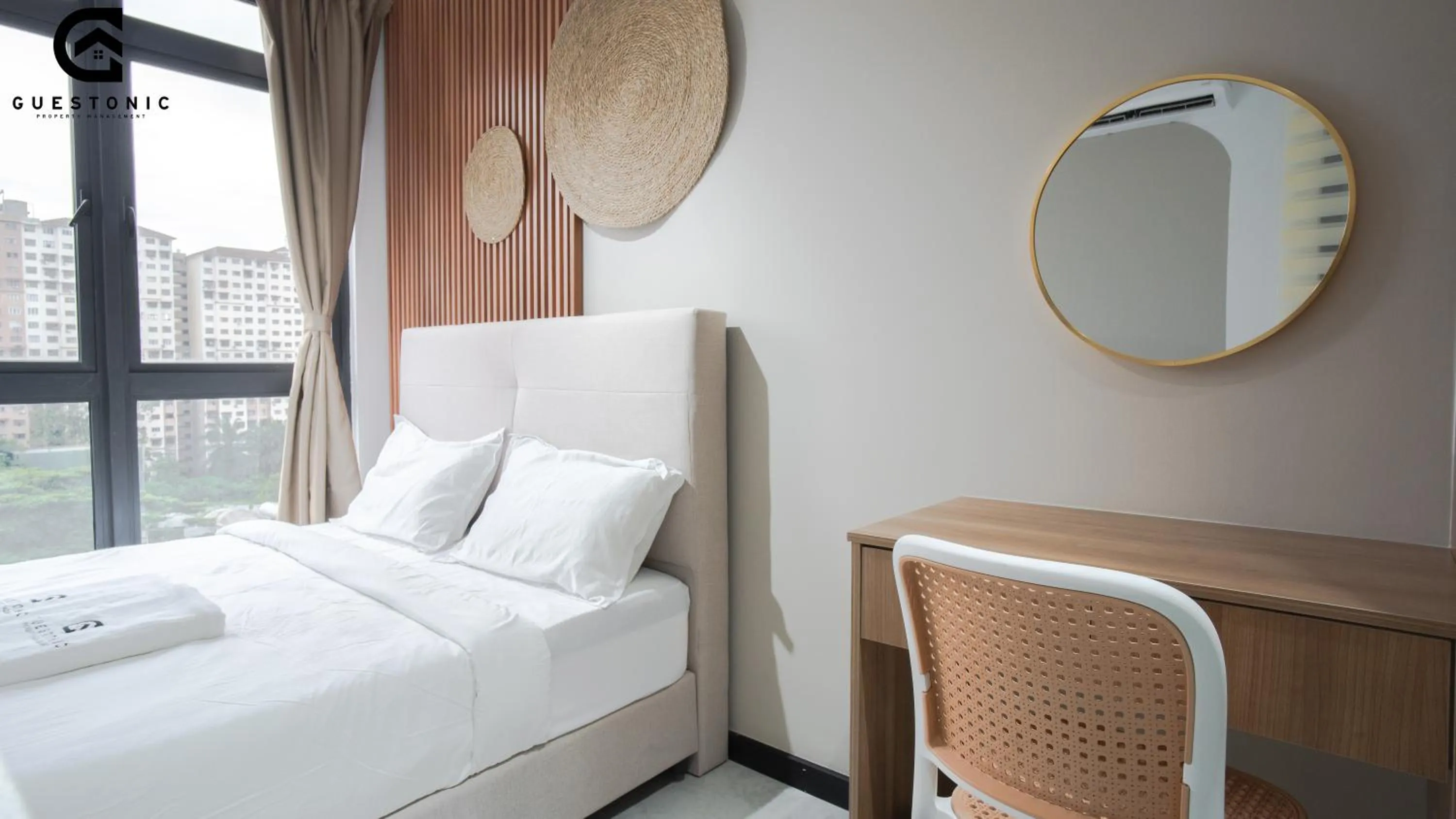 Bed in NeuSuite Cozy Studio by GUESTONIC