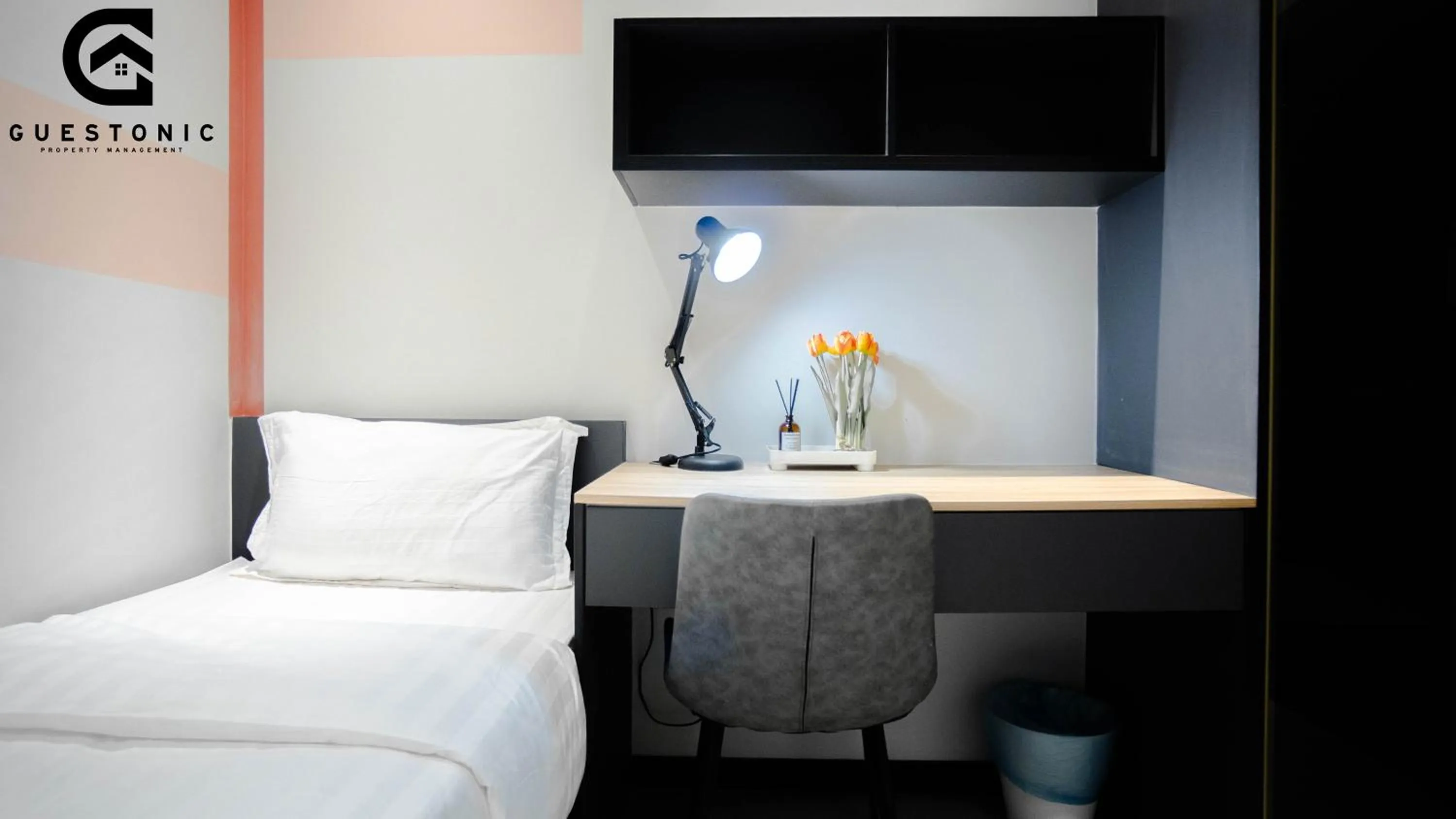 Bed in NeuSuite Cozy Studio by GUESTONIC