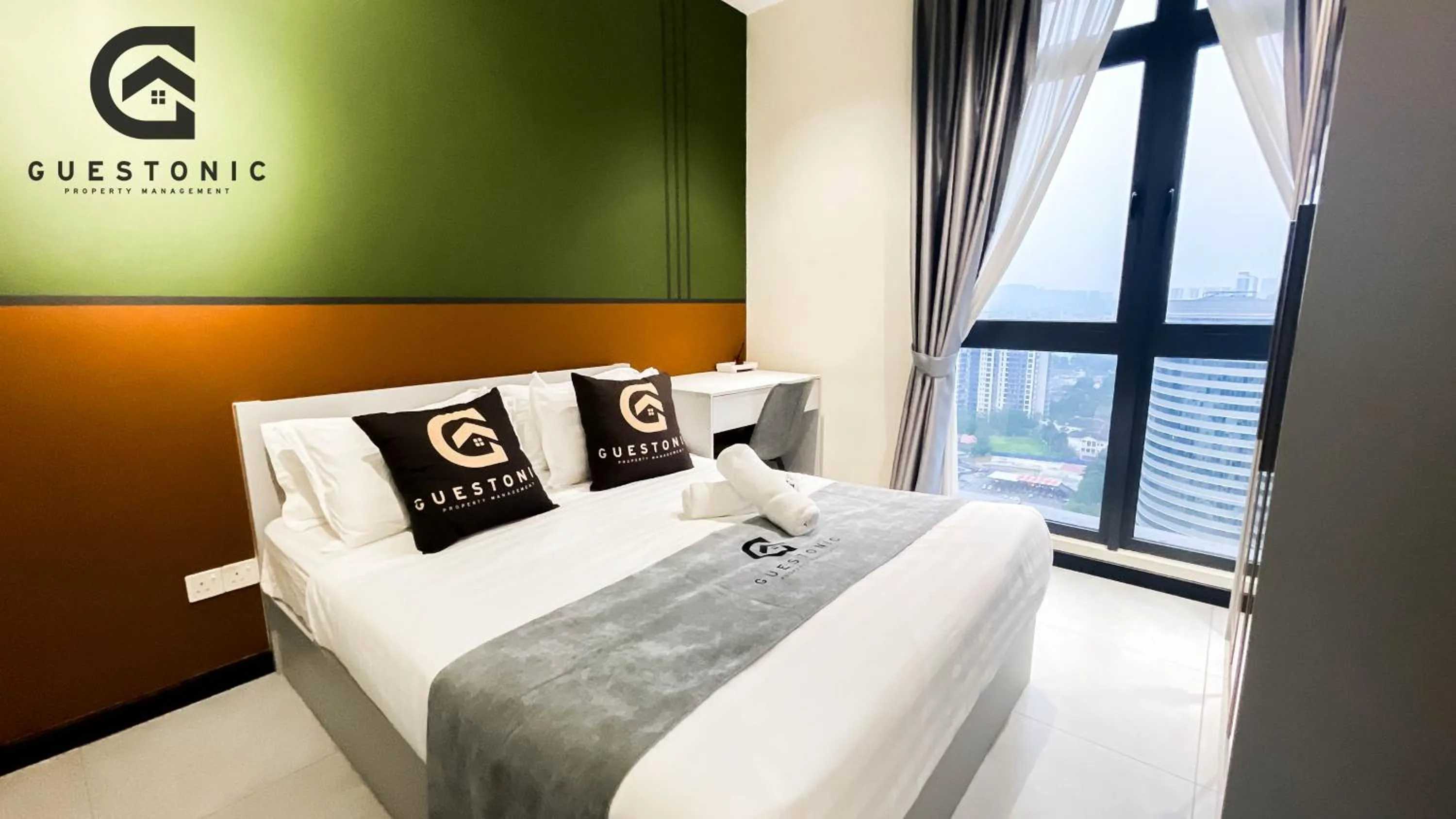 Bed in NeuSuite Cozy Studio by GUESTONIC