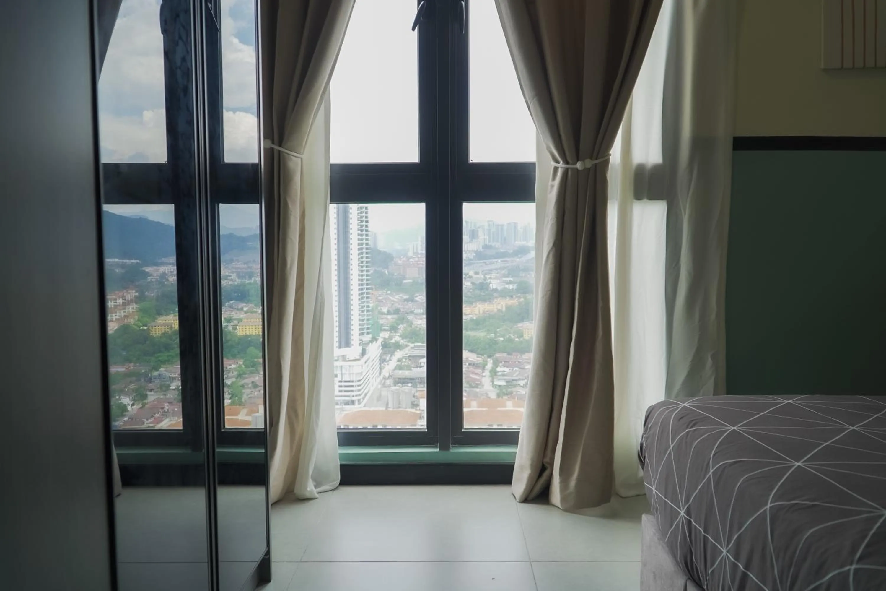 Bed in NeuSuite Cozy Studio by GUESTONIC