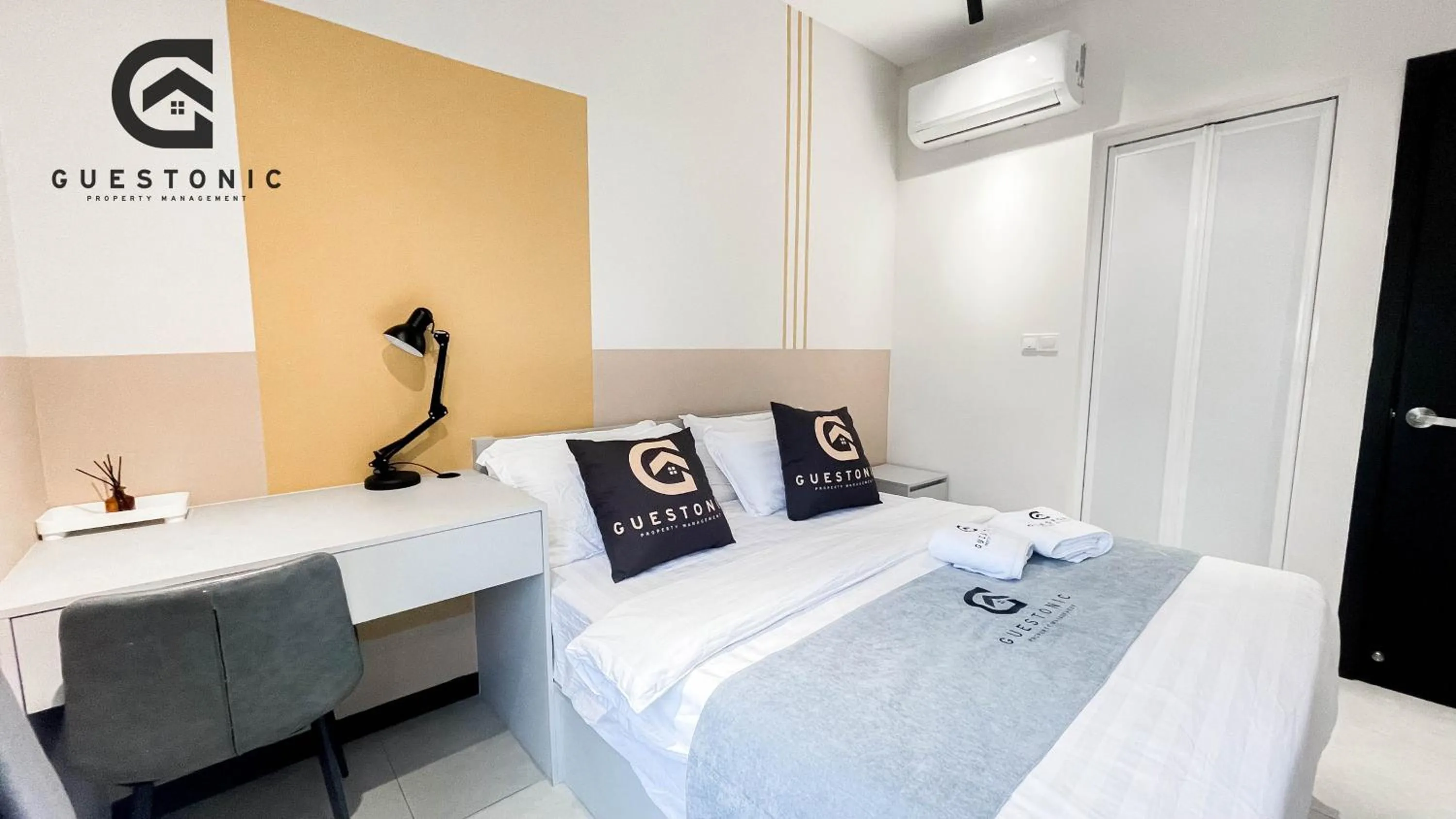 Bed in NeuSuite Cozy Studio by GUESTONIC