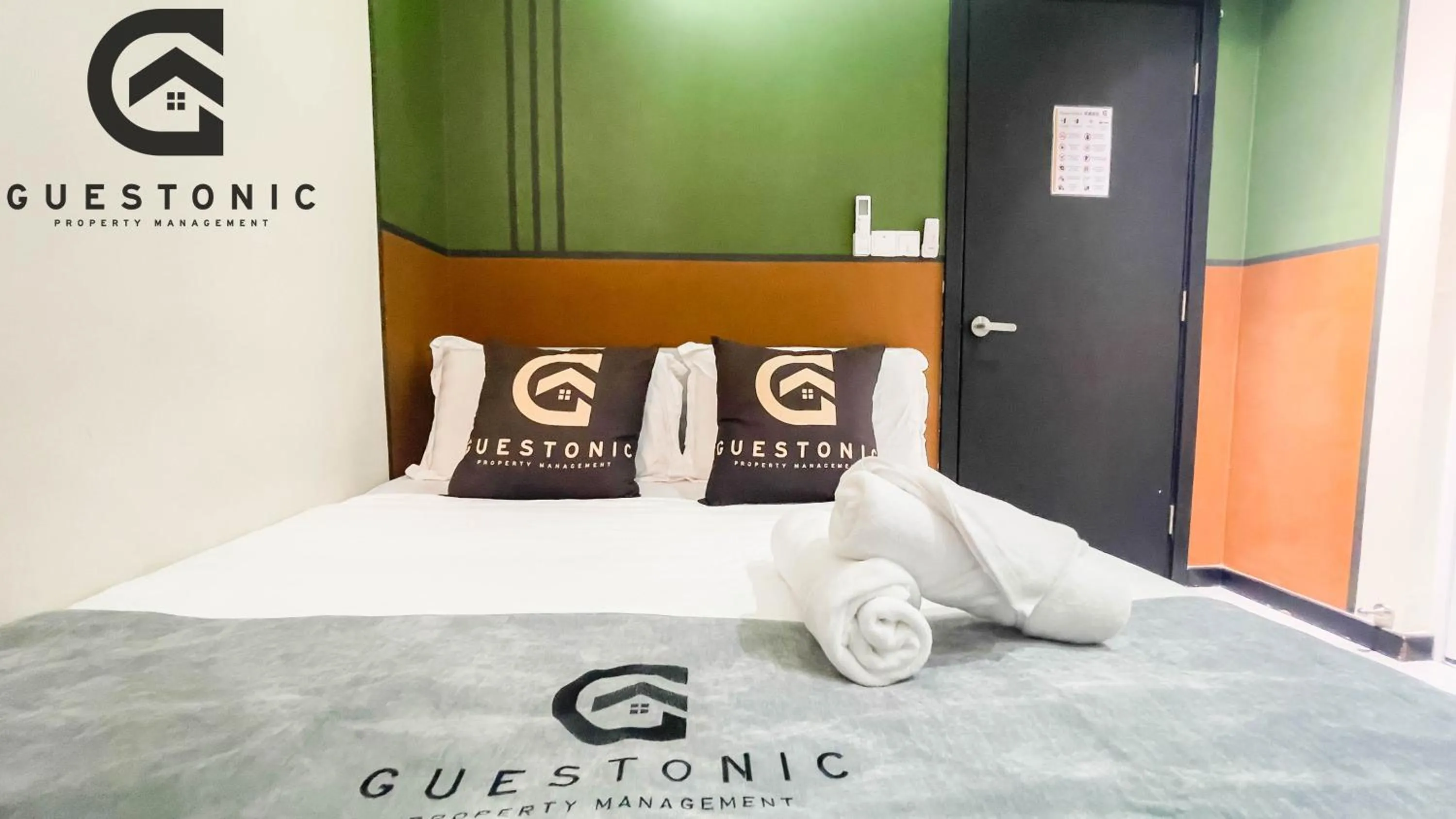 Bed in NeuSuite Cozy Studio by GUESTONIC