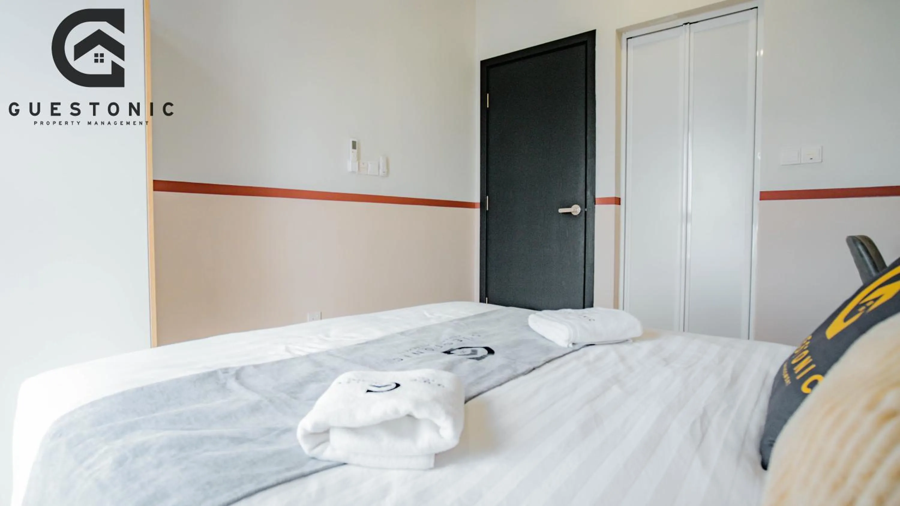 Bed in NeuSuite Cozy Studio by GUESTONIC