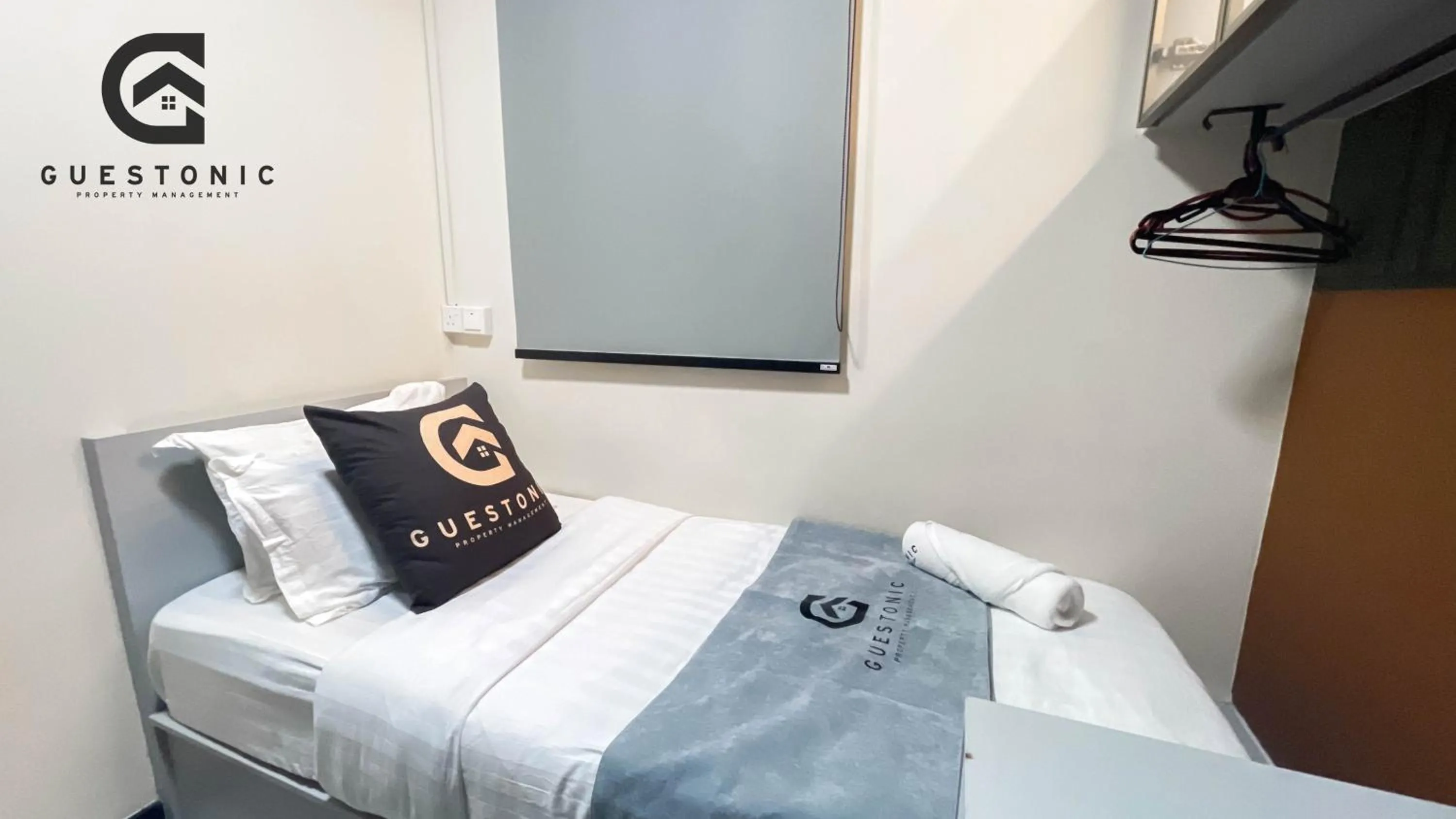 Bed in NeuSuite Cozy Studio by GUESTONIC