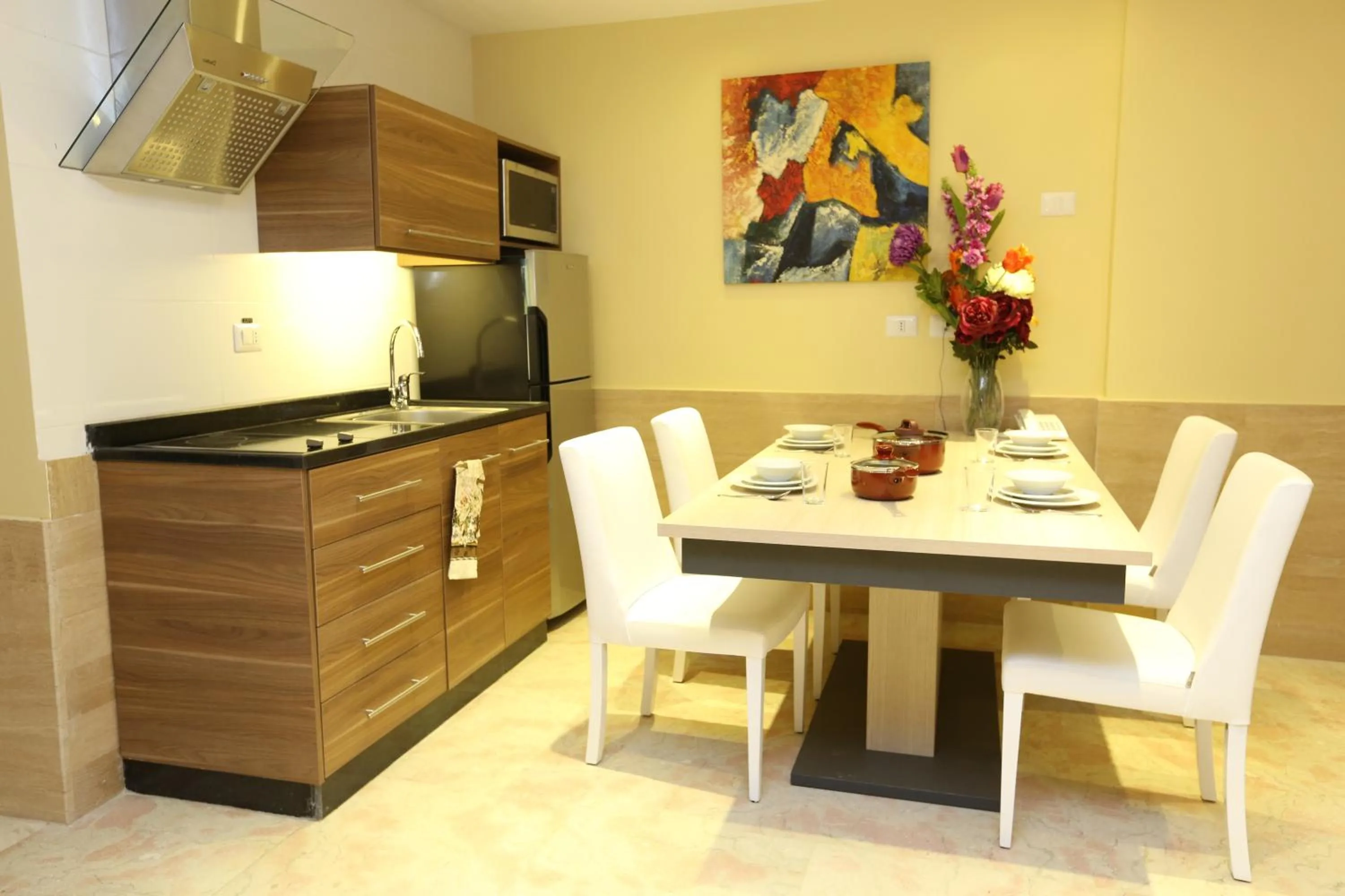 Kitchen or kitchenette in Delora Hotel and Suites