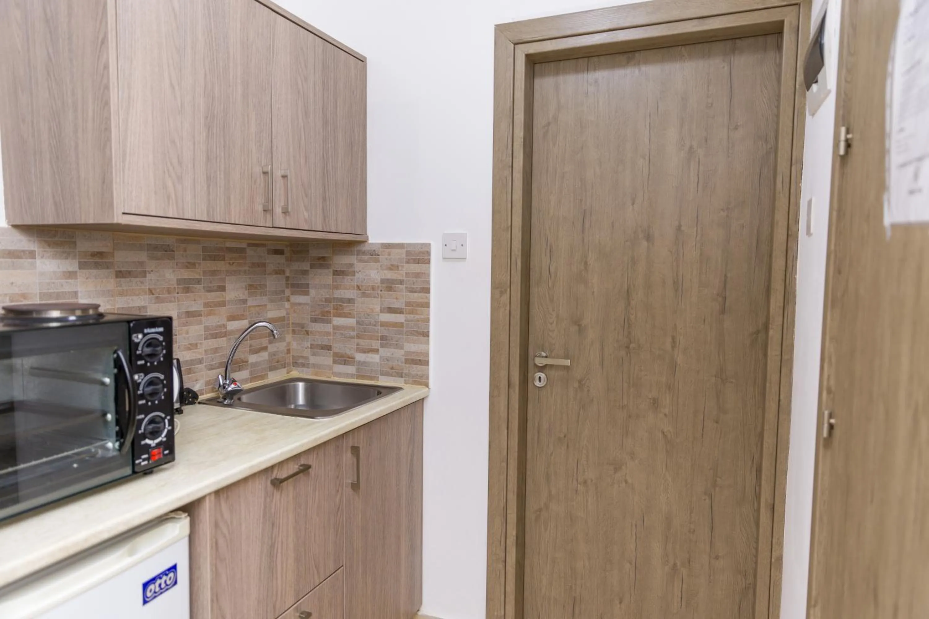 Kitchen or kitchenette in Alecos Hotel Apartments