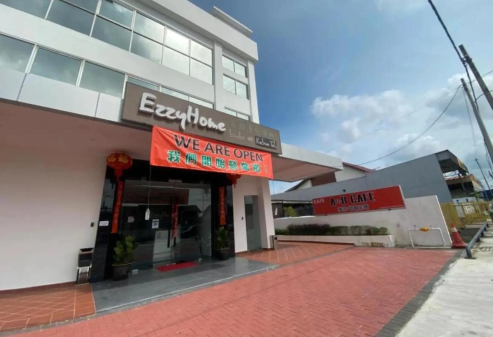 Property logo or sign in Hotel EzzyHome Kebun Teh