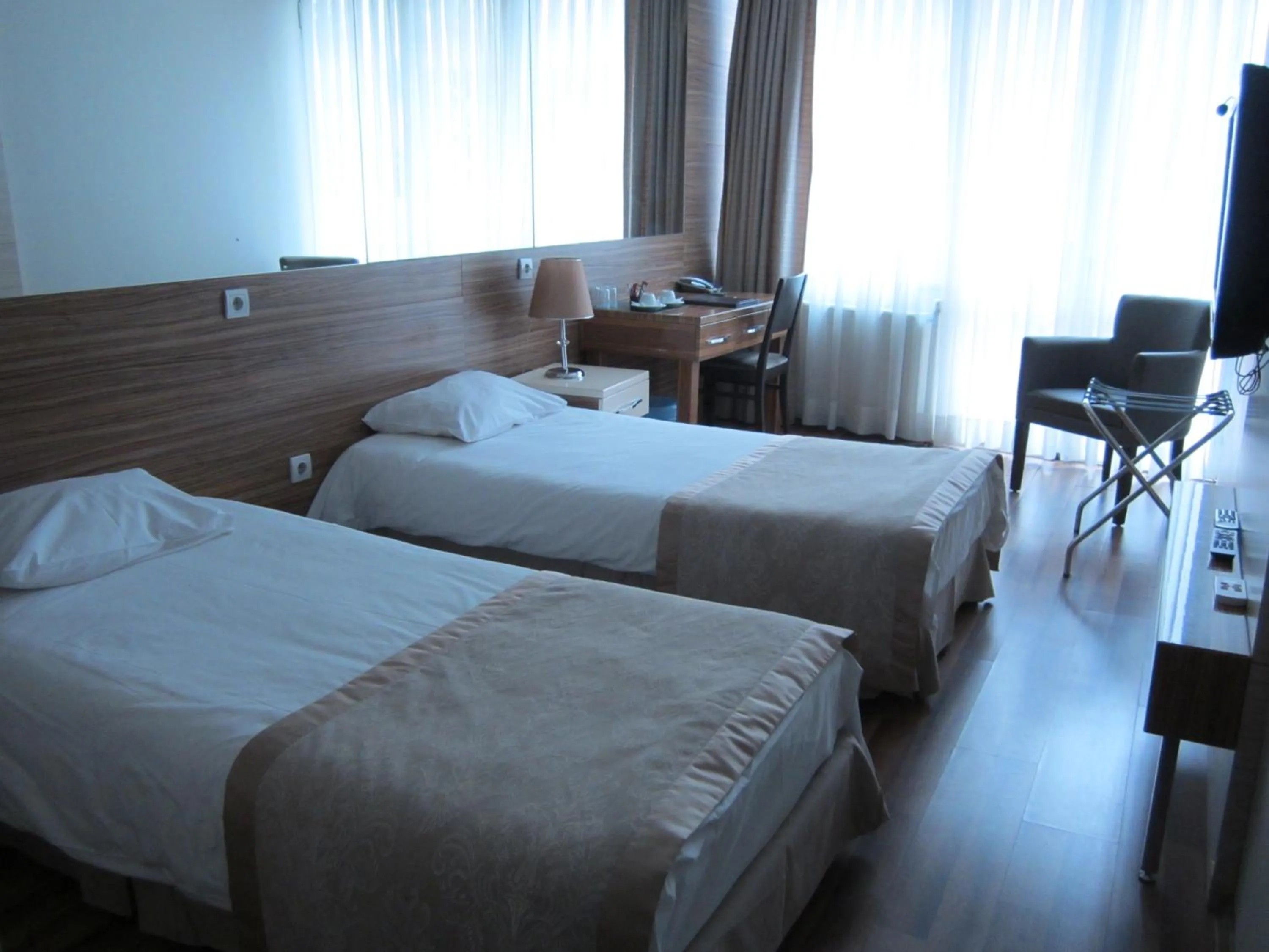 Bed in Derpa Suite Hotel