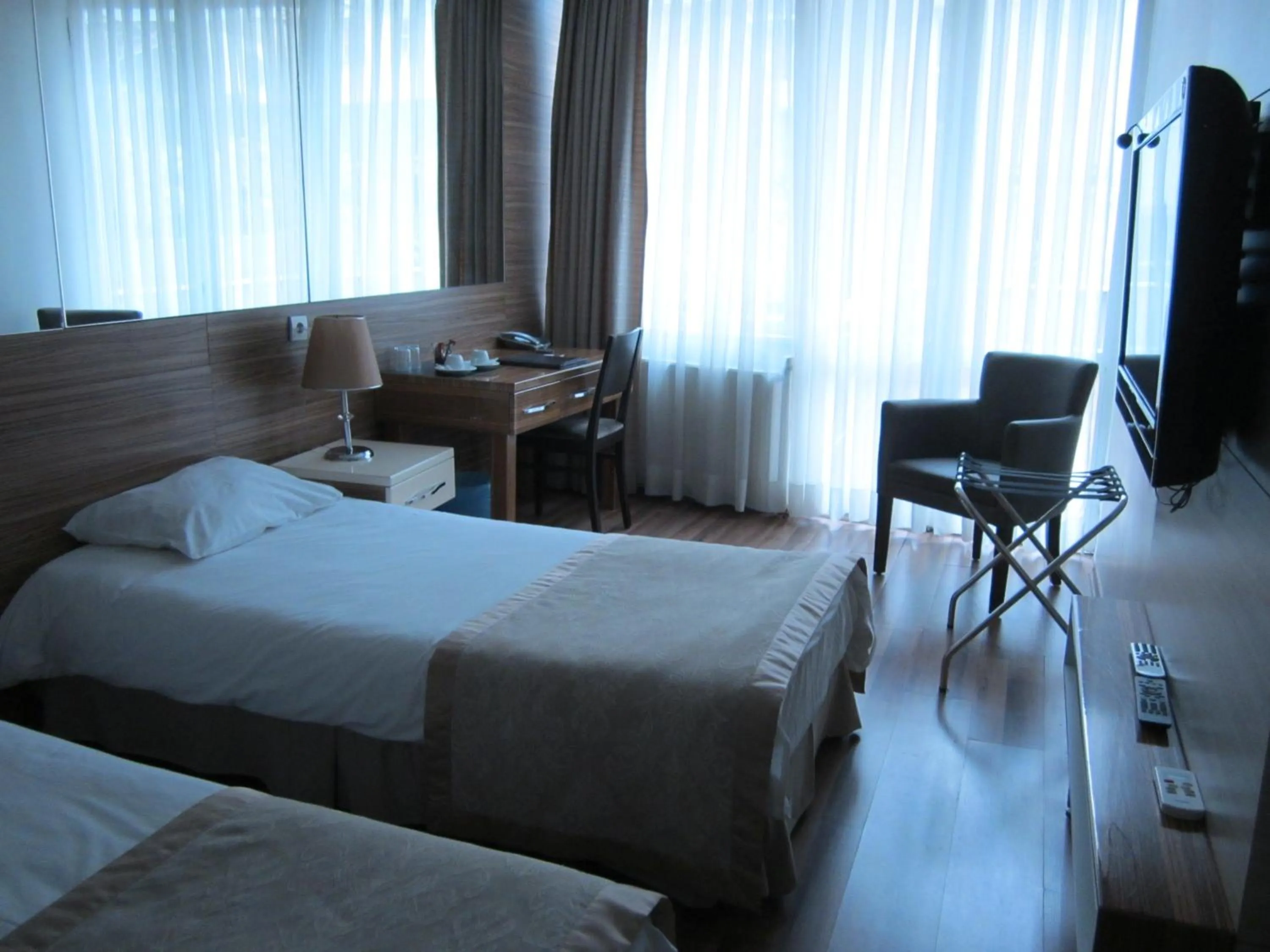Bed in Derpa Suite Hotel