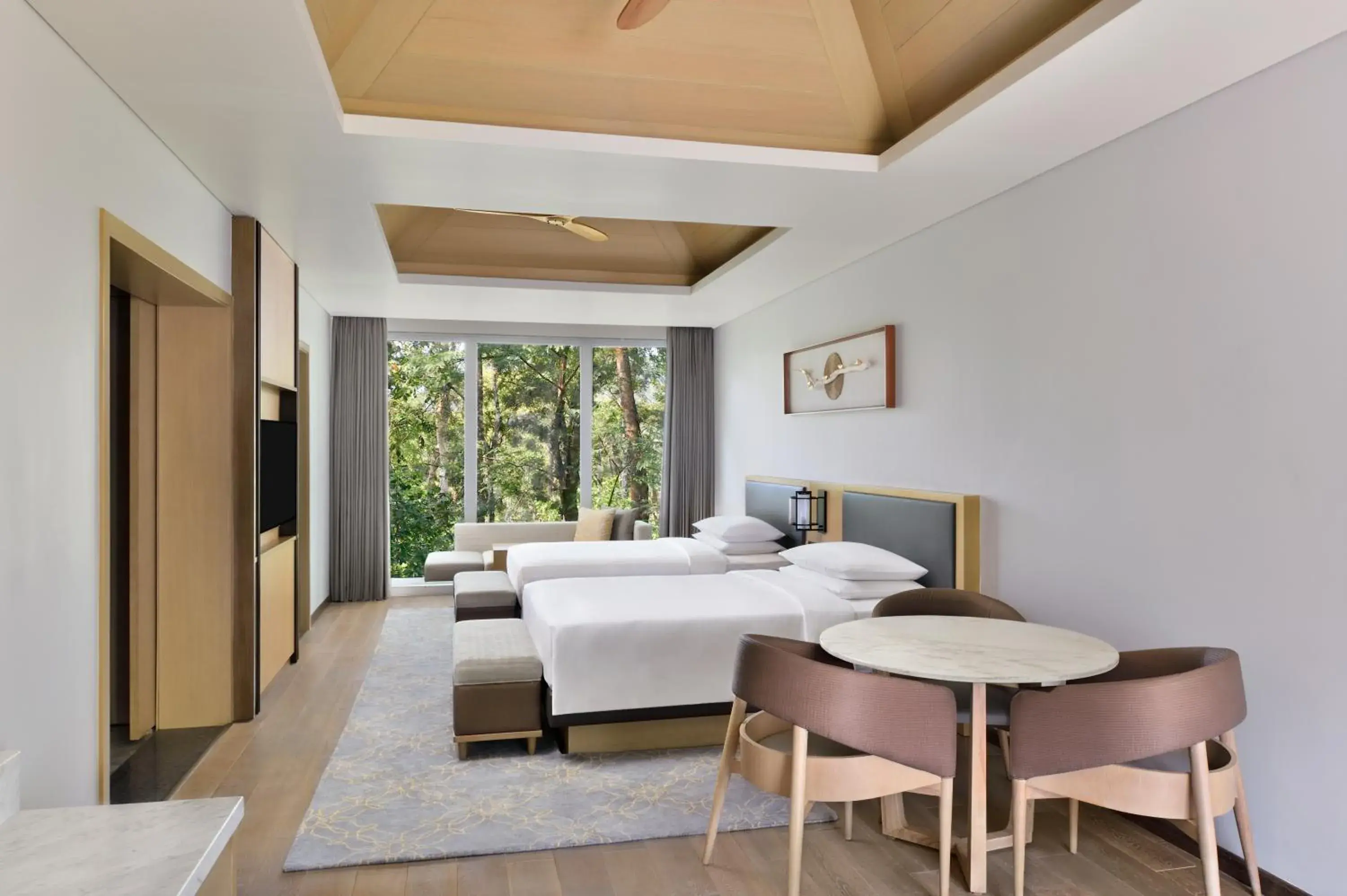 Luxury Cottage with Two Double Beds with Sofa Bed and Garden View in Coorg Marriott Resort & Spa Luxury Cottage with Two Double Beds with Sofa Bed and Garden View in Coorg Marriott Resort & Spa