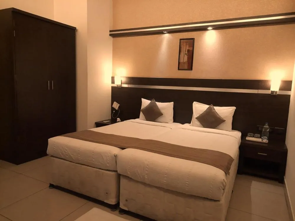Bed in Hotel Nagarjuna Suites