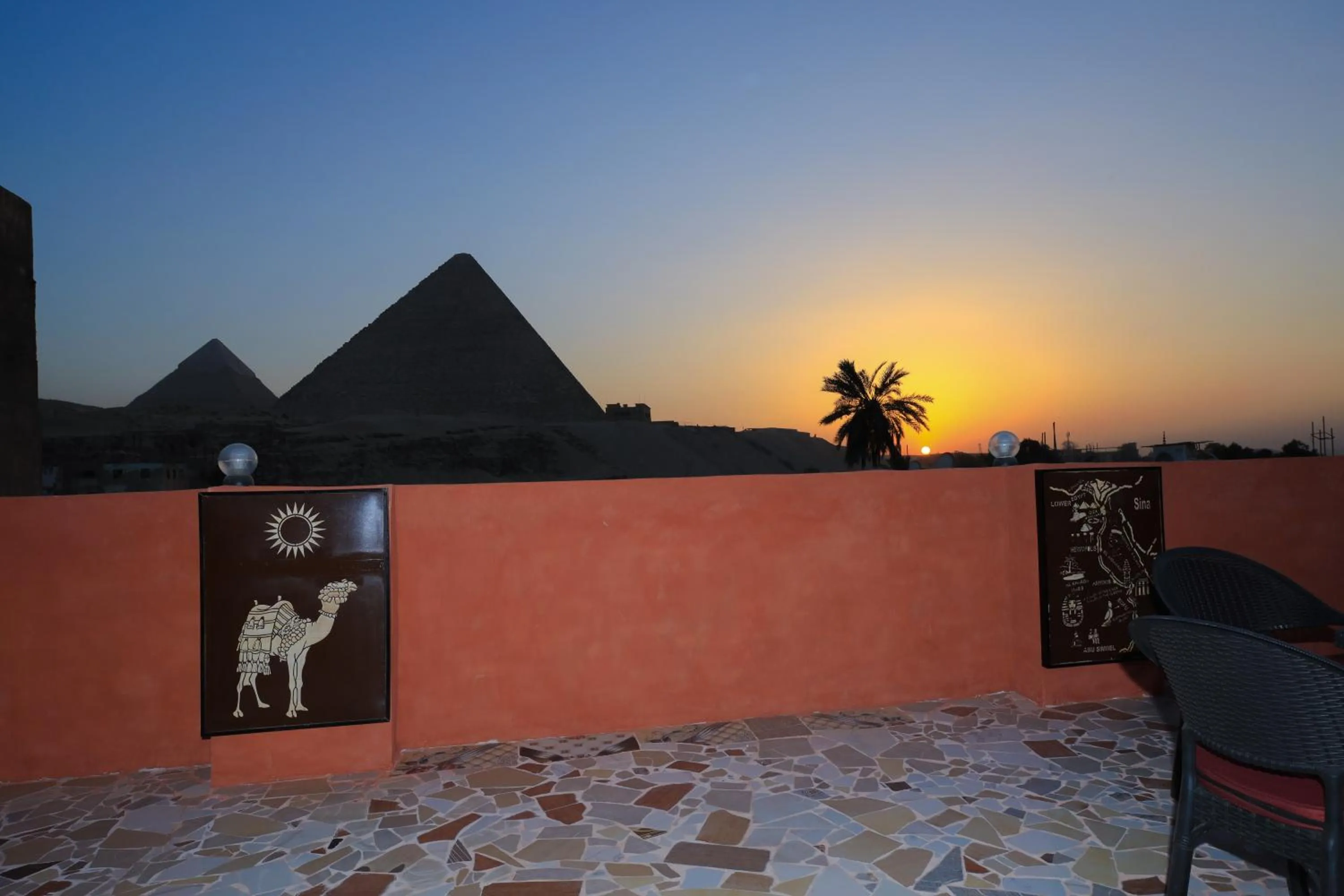 Sunset in El Khalil Pyramids View Inn