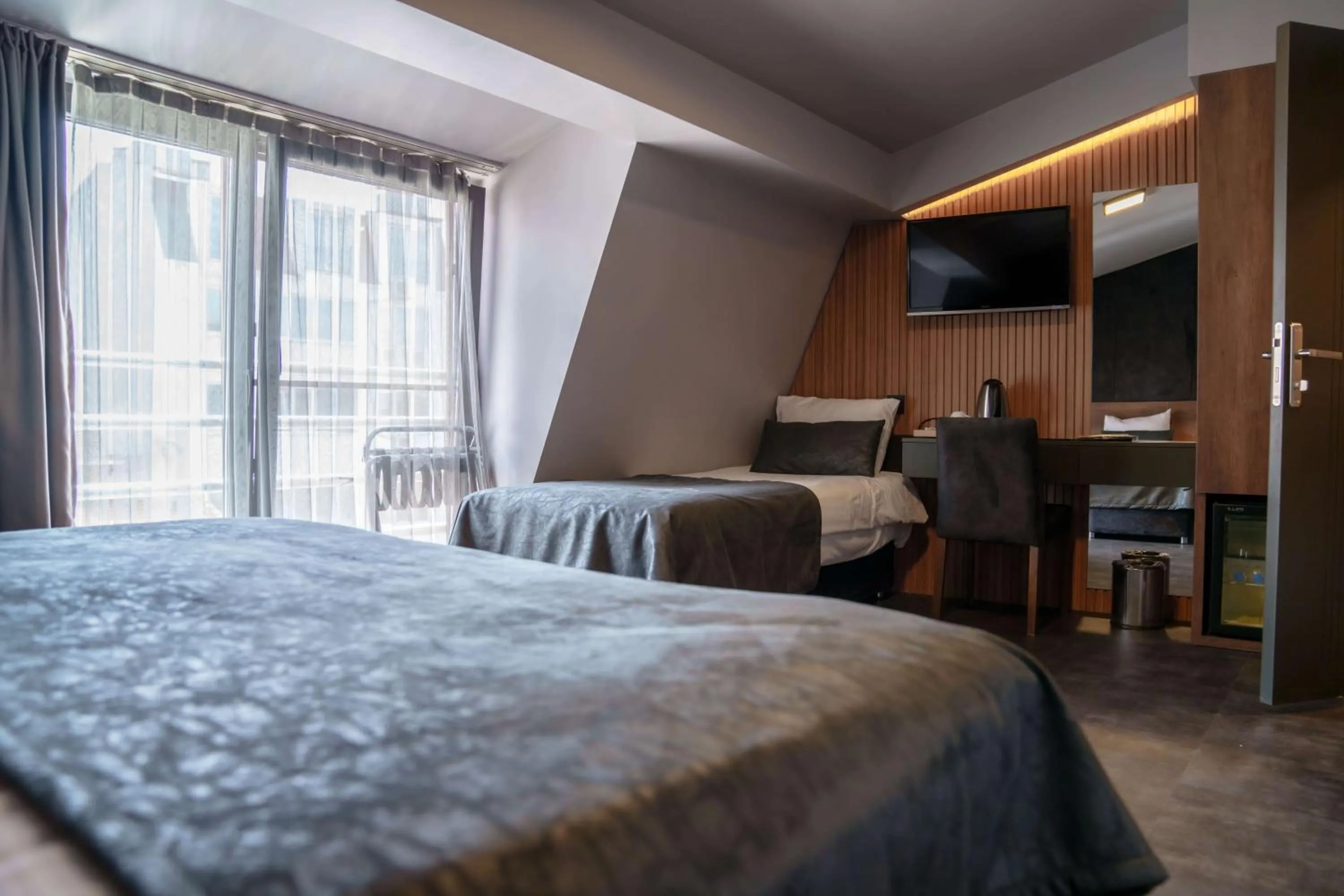 Bed in SennaCity Hotel