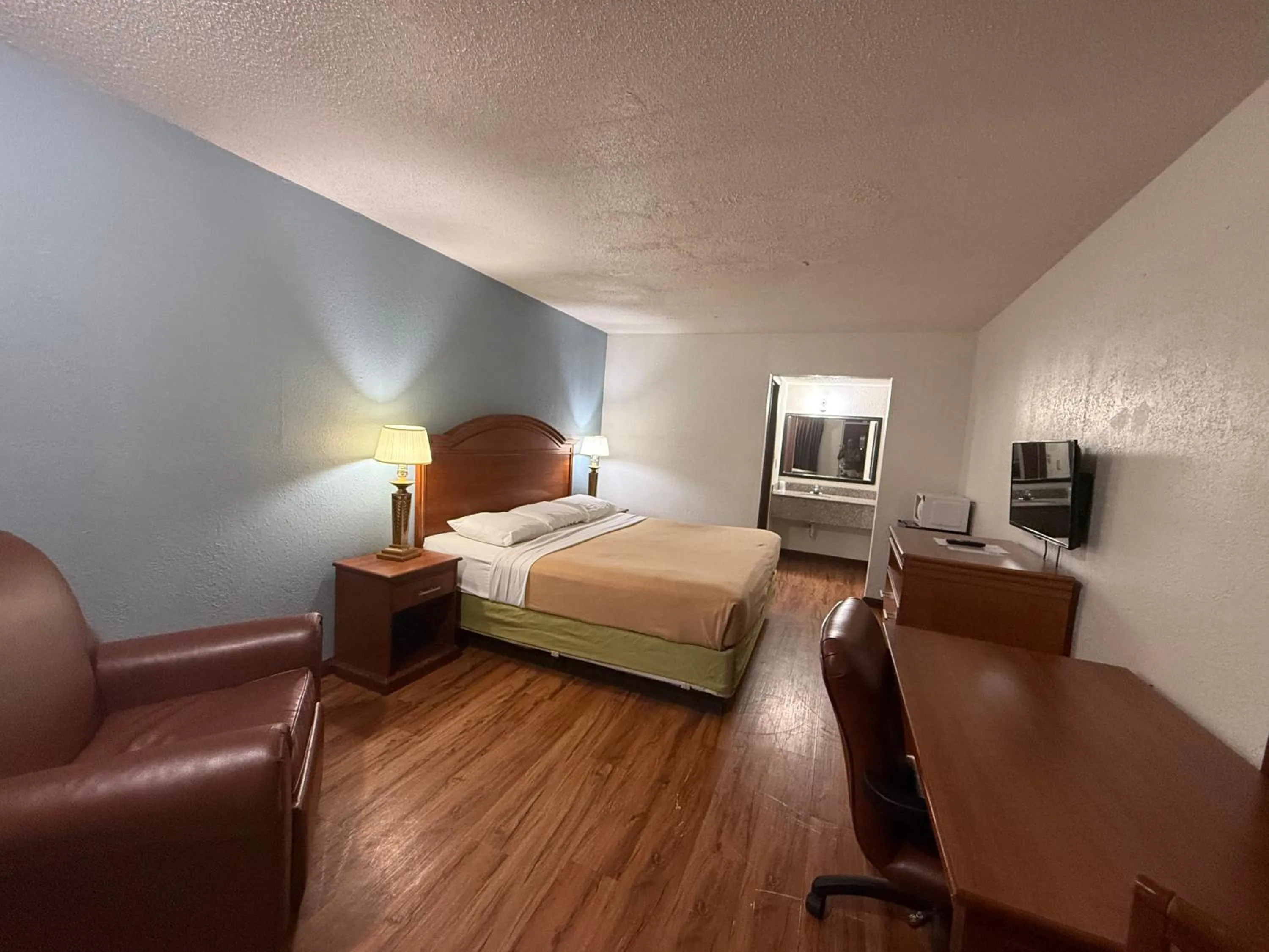 Bed in Relax Inn & Suites