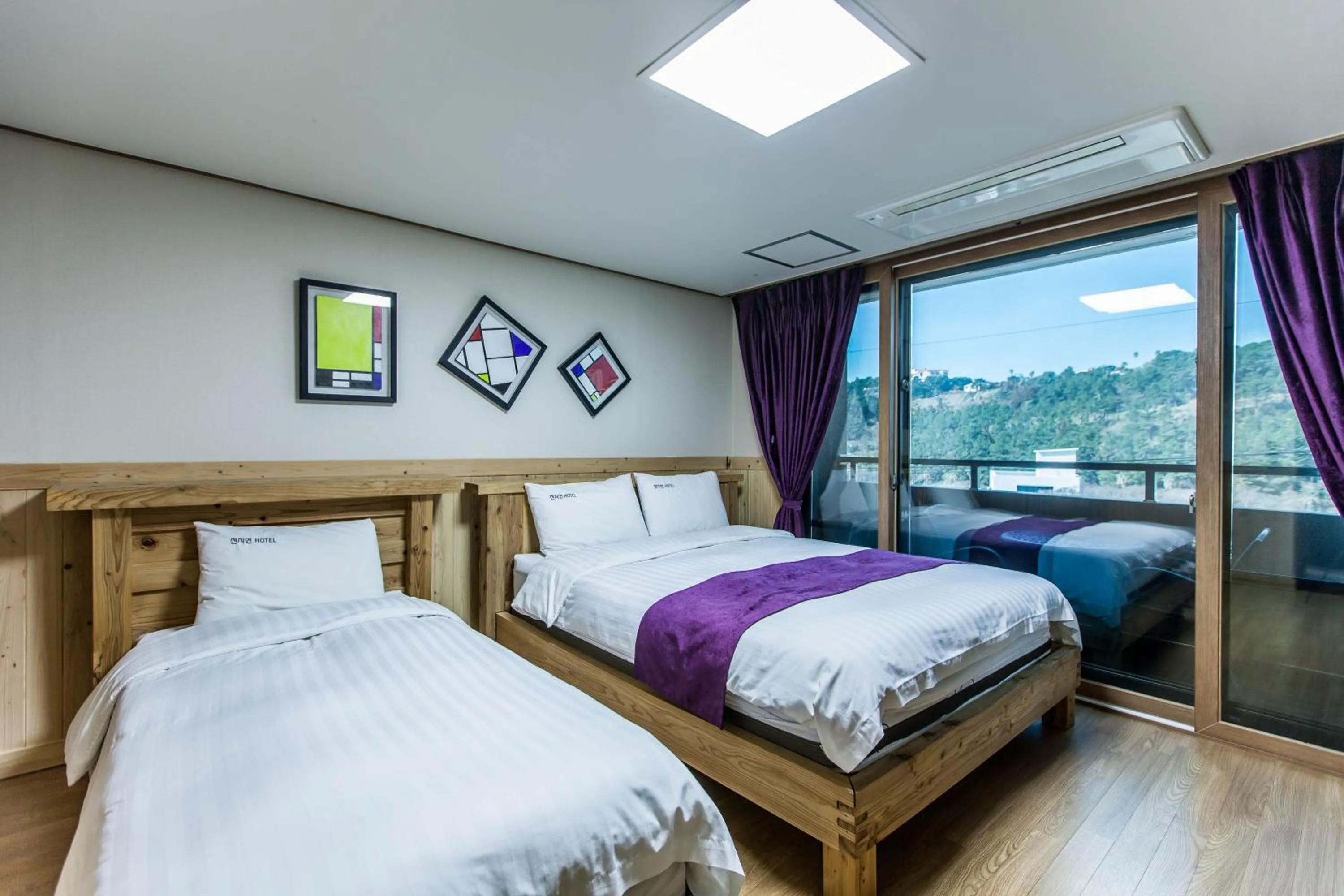 Bed in Cheonjiyeon Hotel