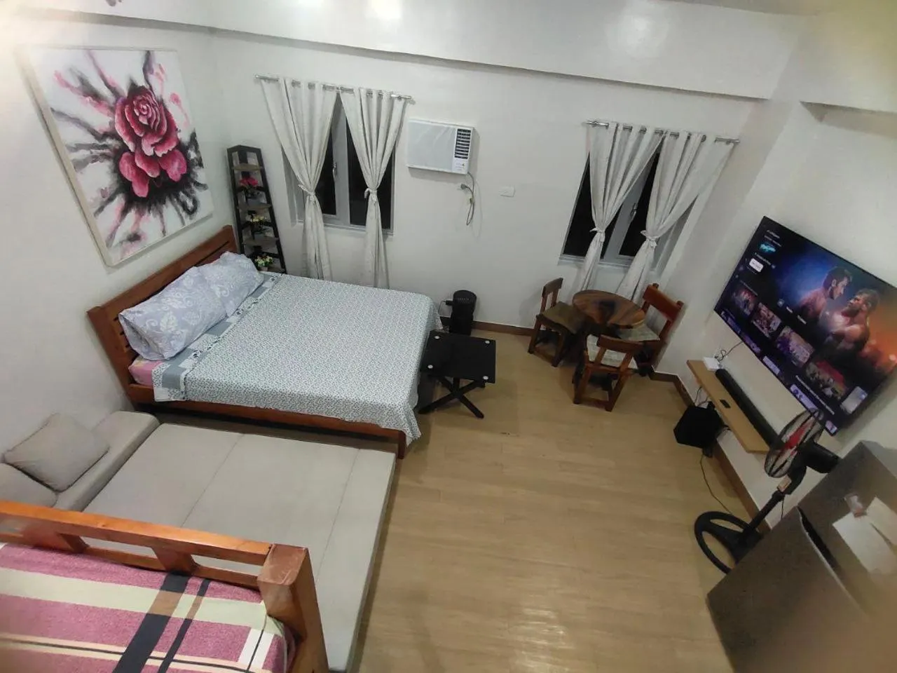 Bed in Happy Stays B - End Unit Greenery View at SMDC Hope Residences