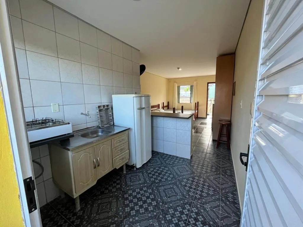 Kitchen or kitchenette in Pousada Caraguá