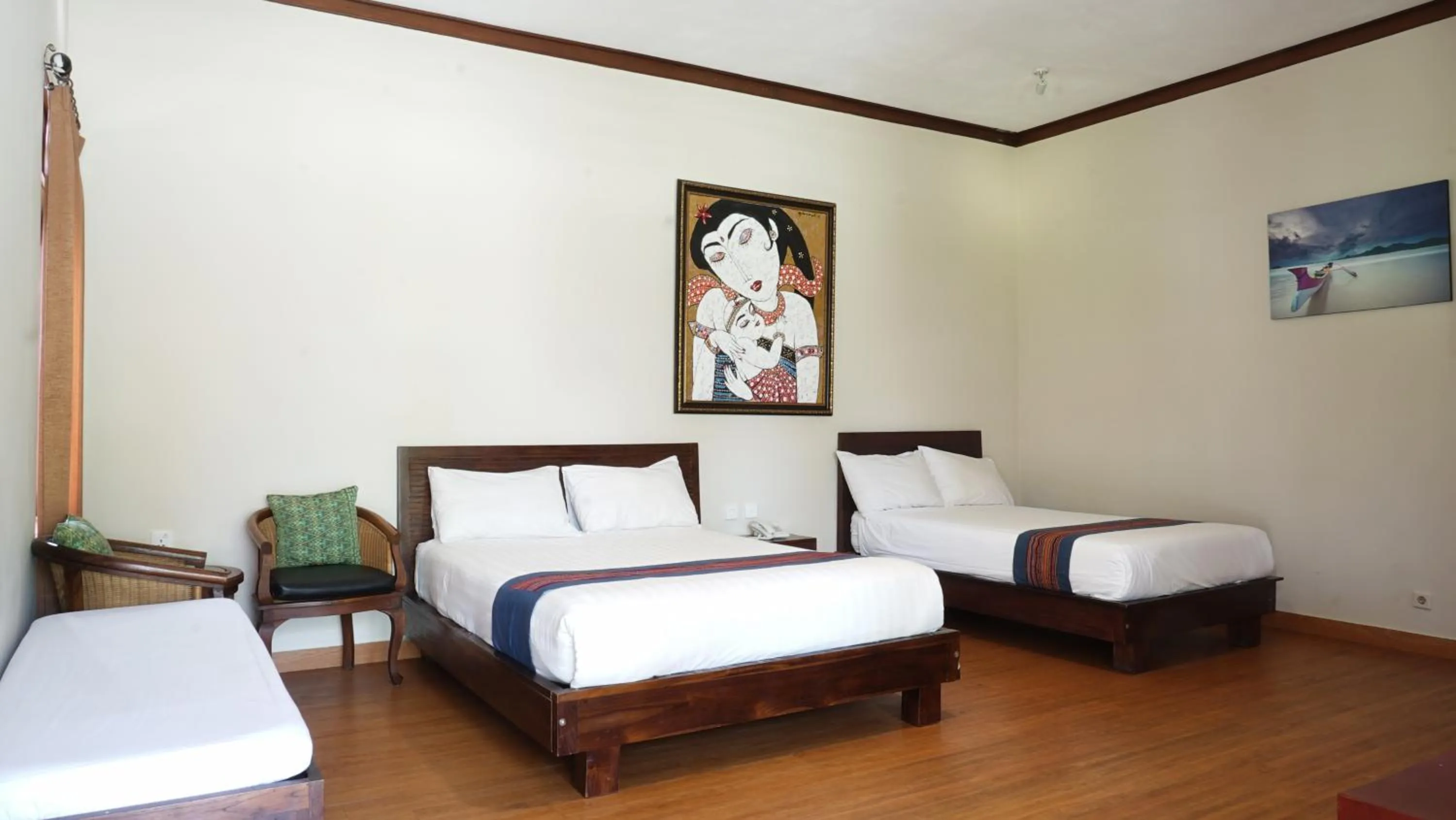 Bed in Puri Rinjani Bungalows