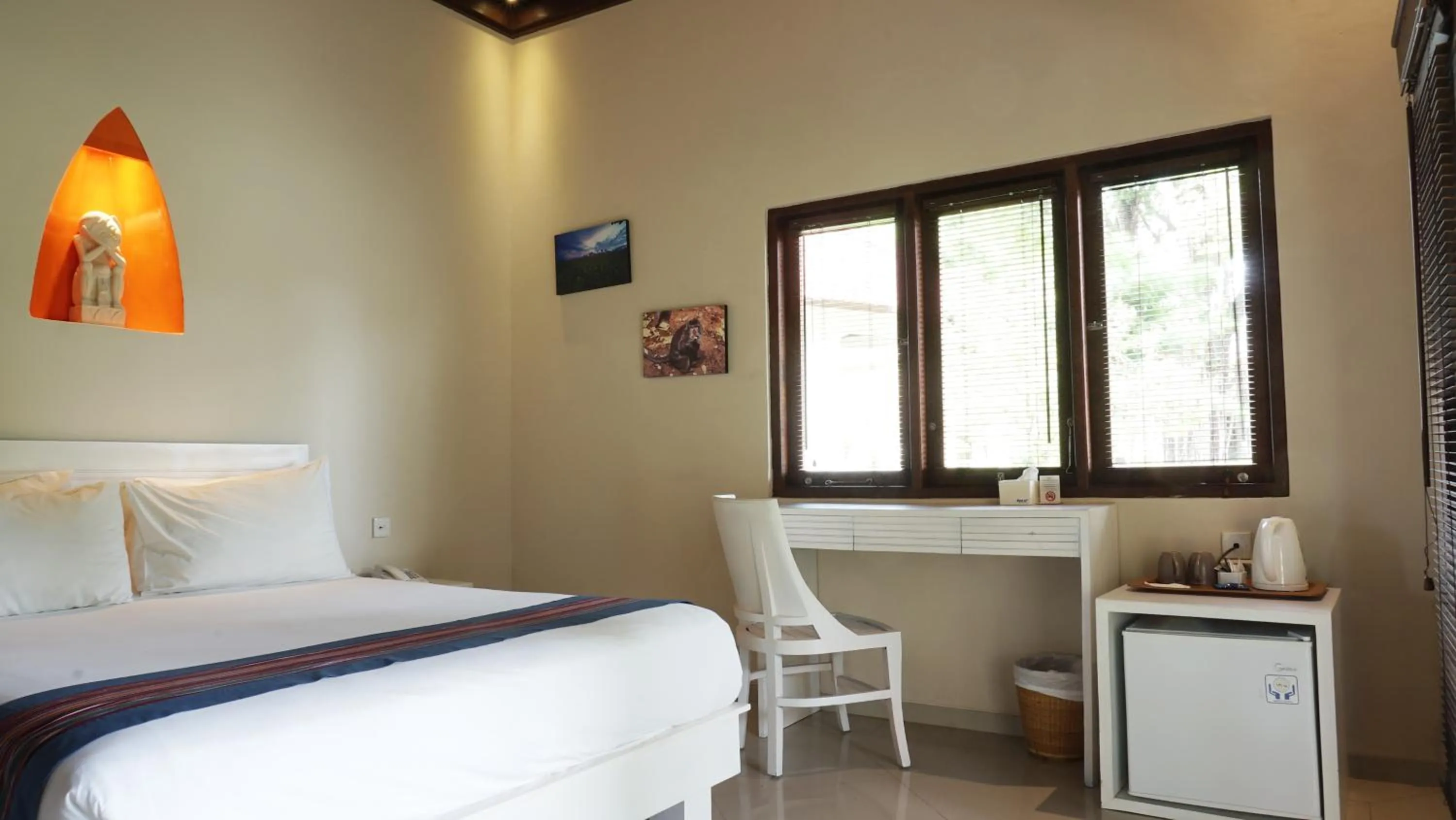 Bed in Puri Rinjani Bungalows