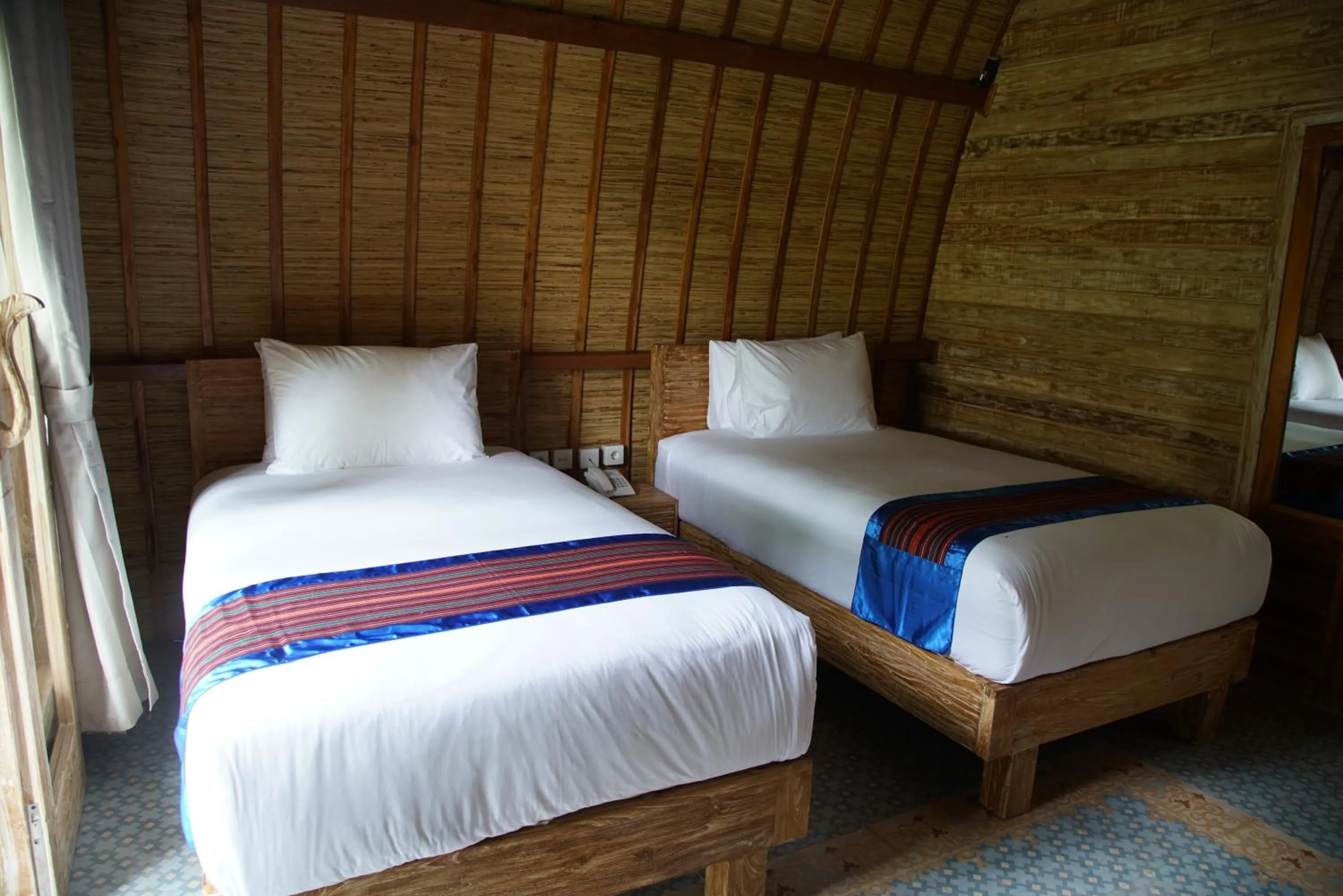 Bed in Puri Rinjani Bungalows