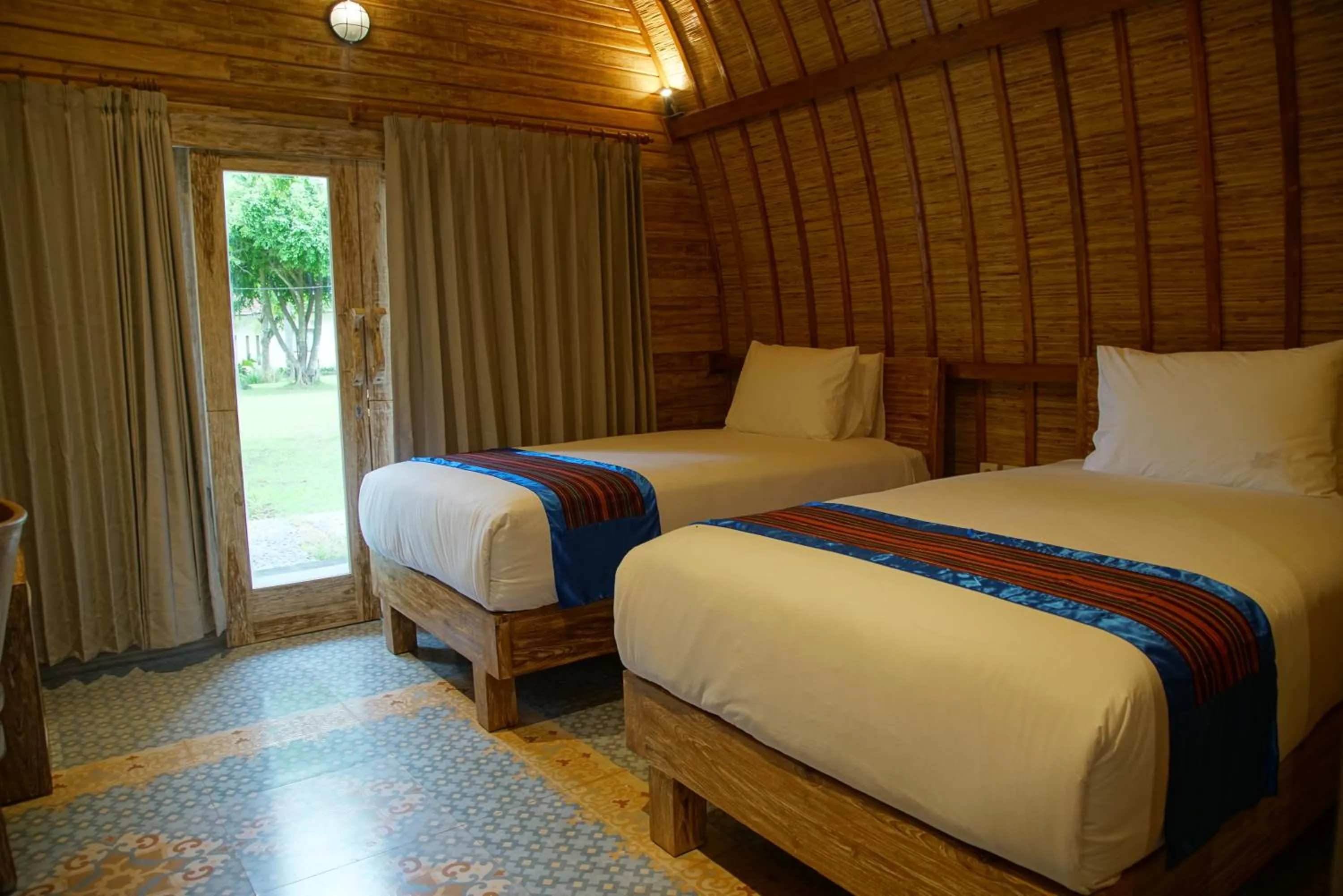 Bed in Puri Rinjani Bungalows