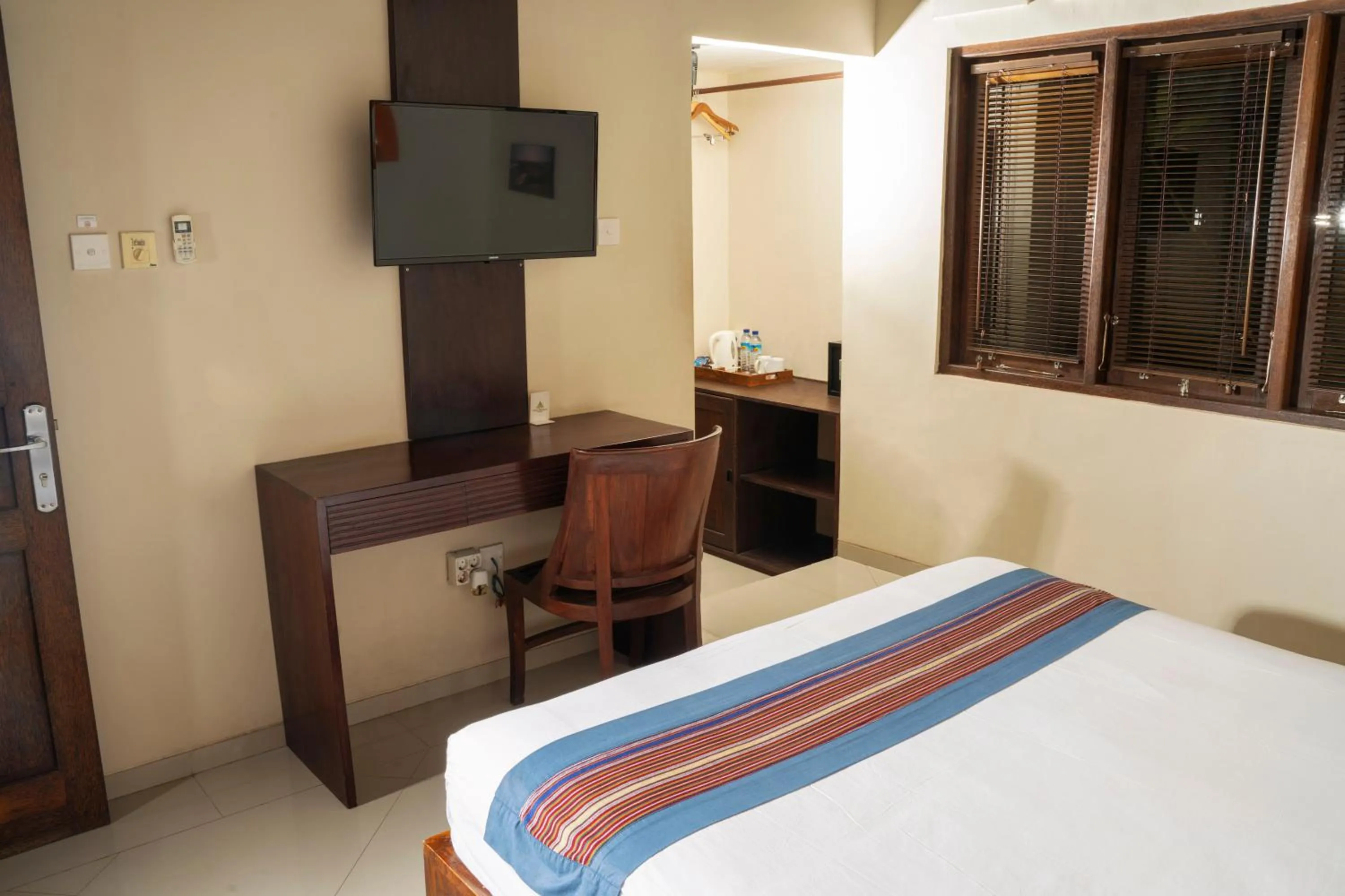 Bed in Puri Rinjani Bungalows