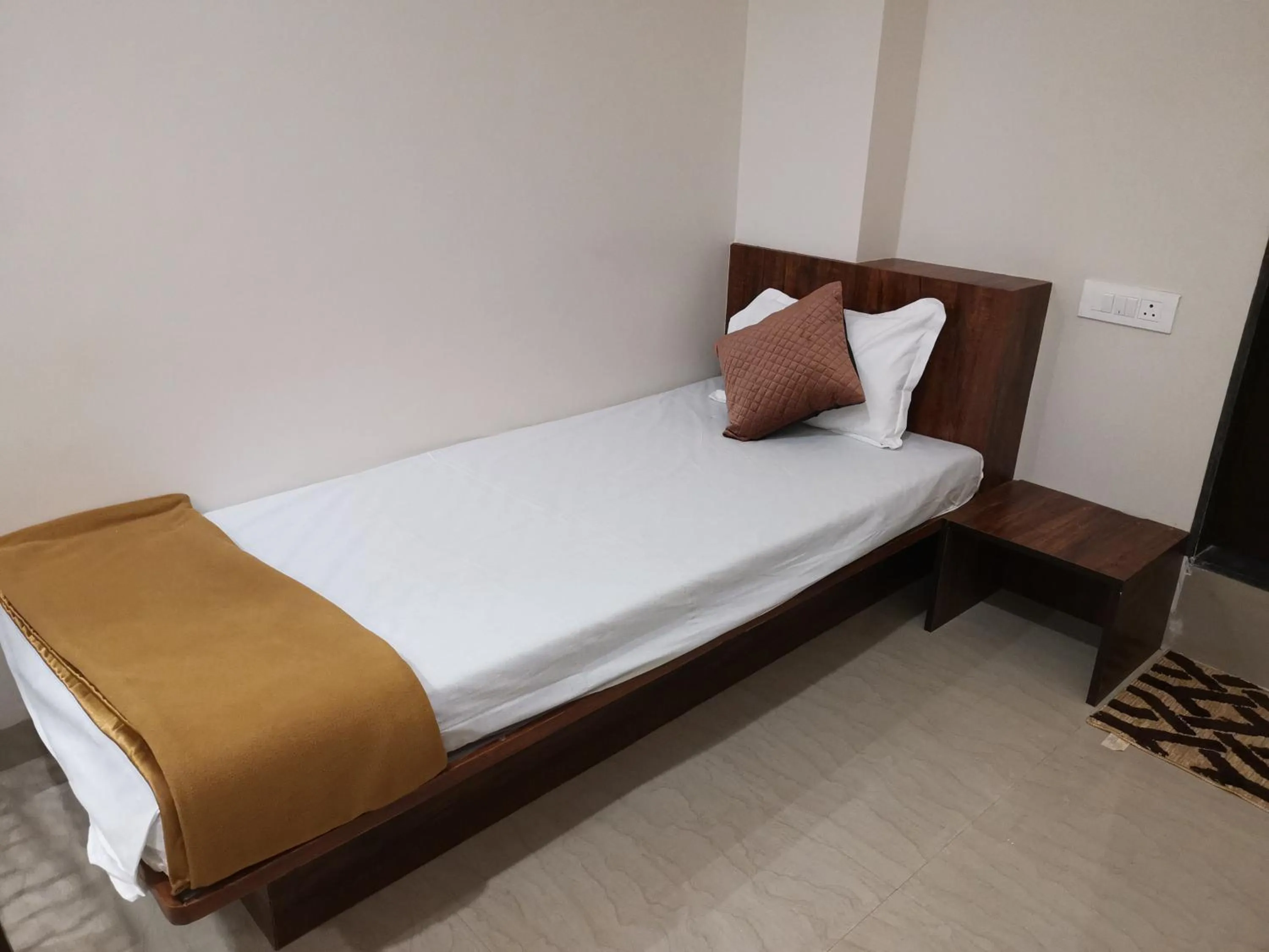 Bed in Hotel Darshan Grand