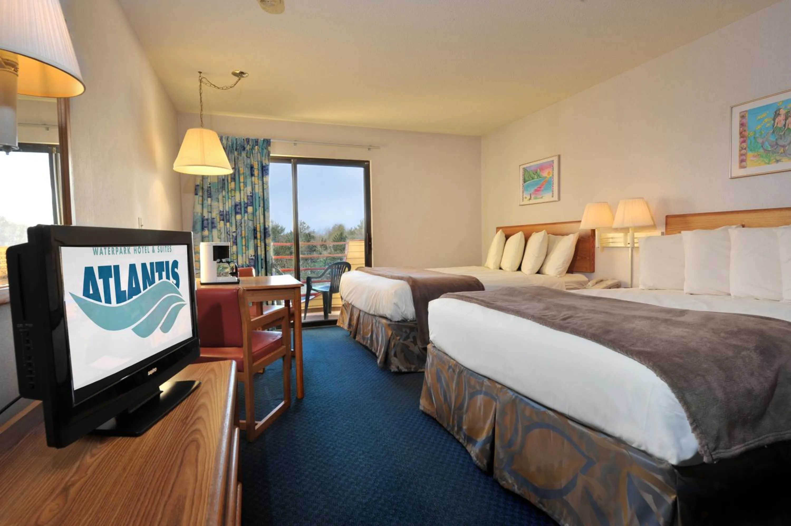 Bed in Atlantis Family Waterpark Hotel, an Ascend Collection Hotel