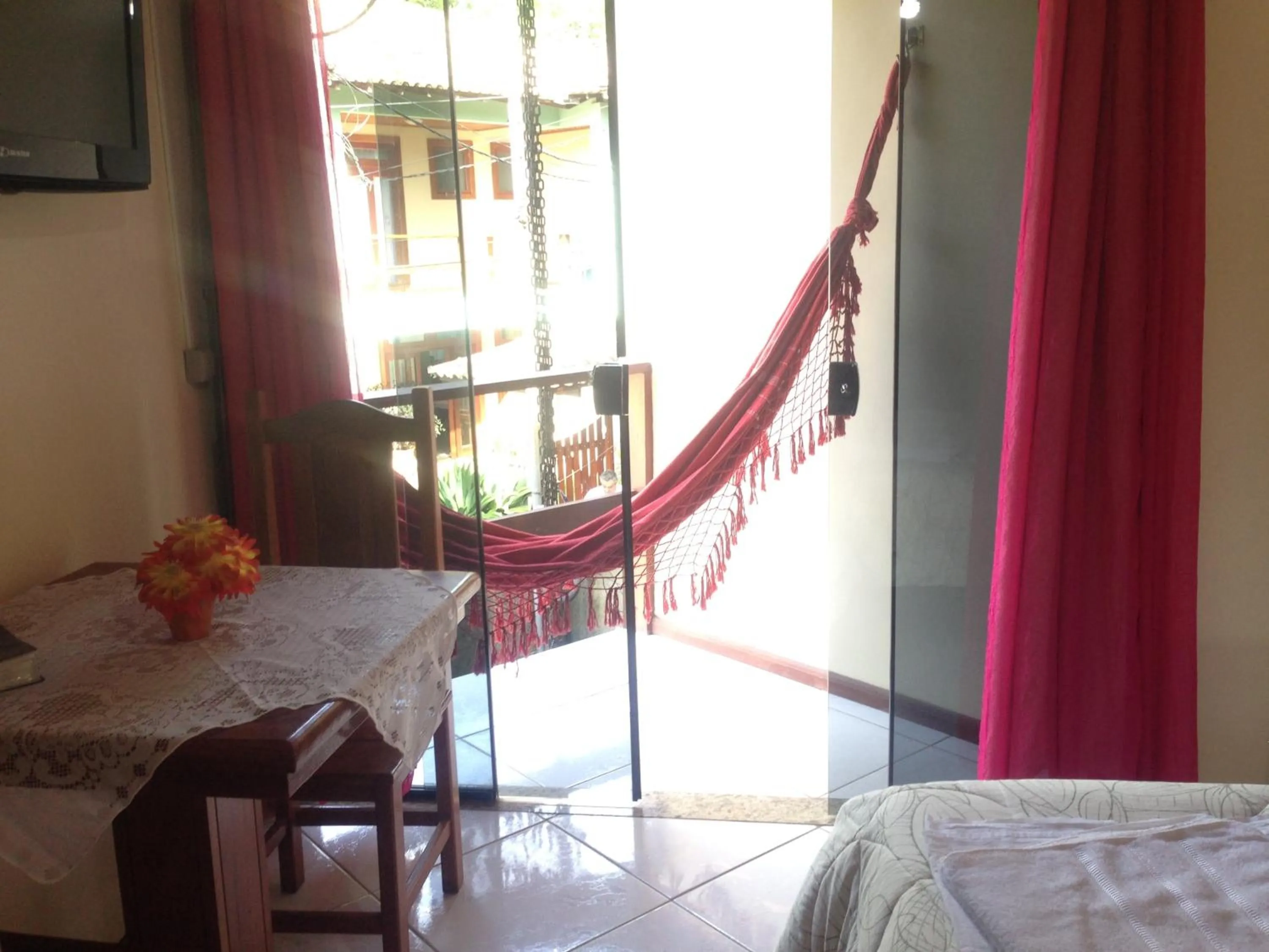 Balcony/Terrace, Bed in Pousada Recanto do Sabiá