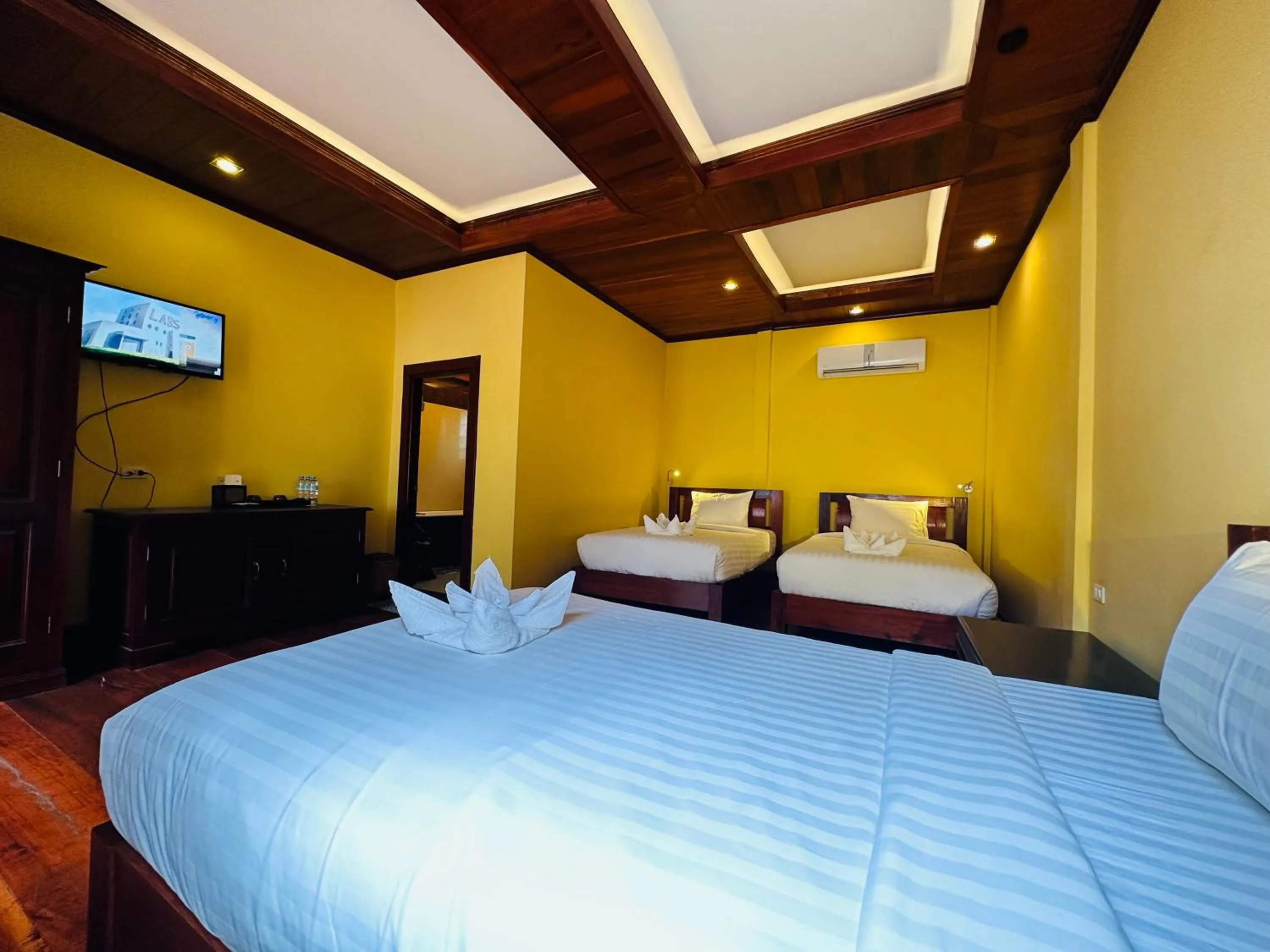 Bed in Villa Phonethip Mekong Riverside