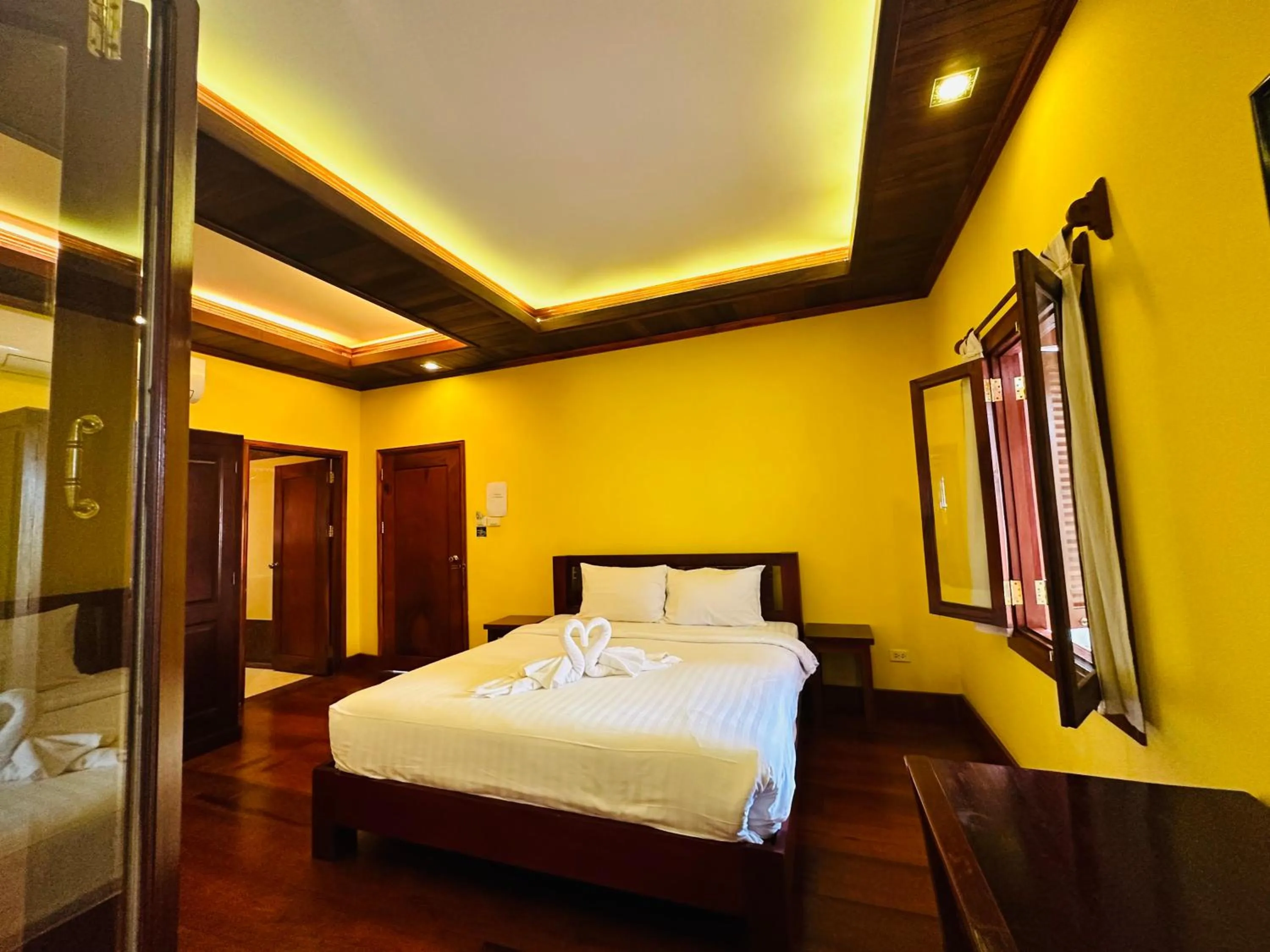 Bed in Villa Phonethip Mekong Riverside