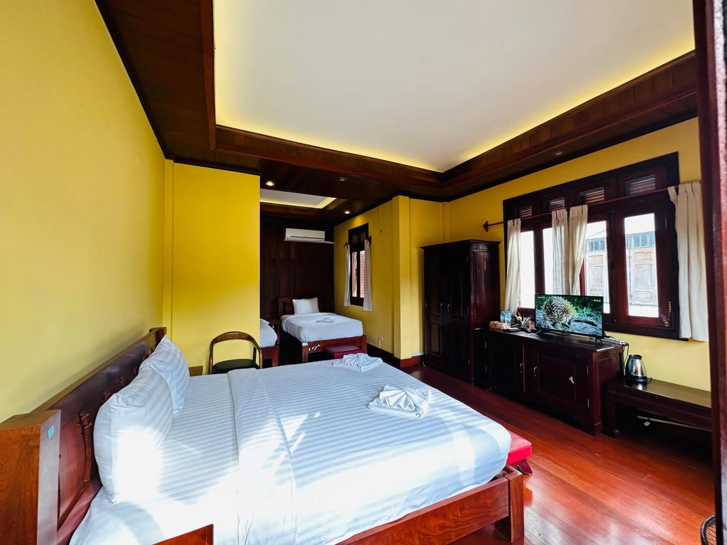 Bed in Villa Phonethip Mekong Riverside