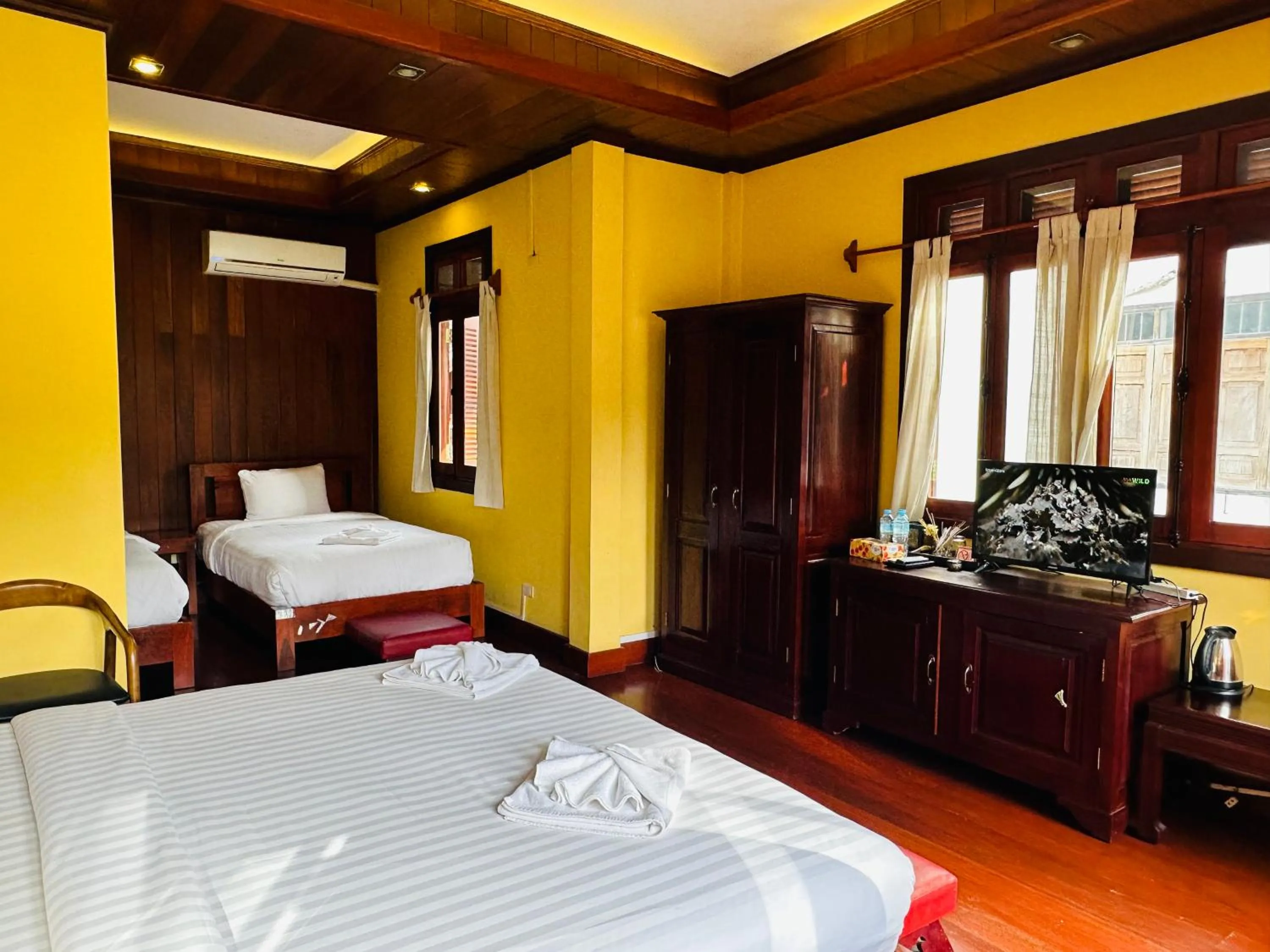 Bed in Villa Phonethip Mekong Riverside