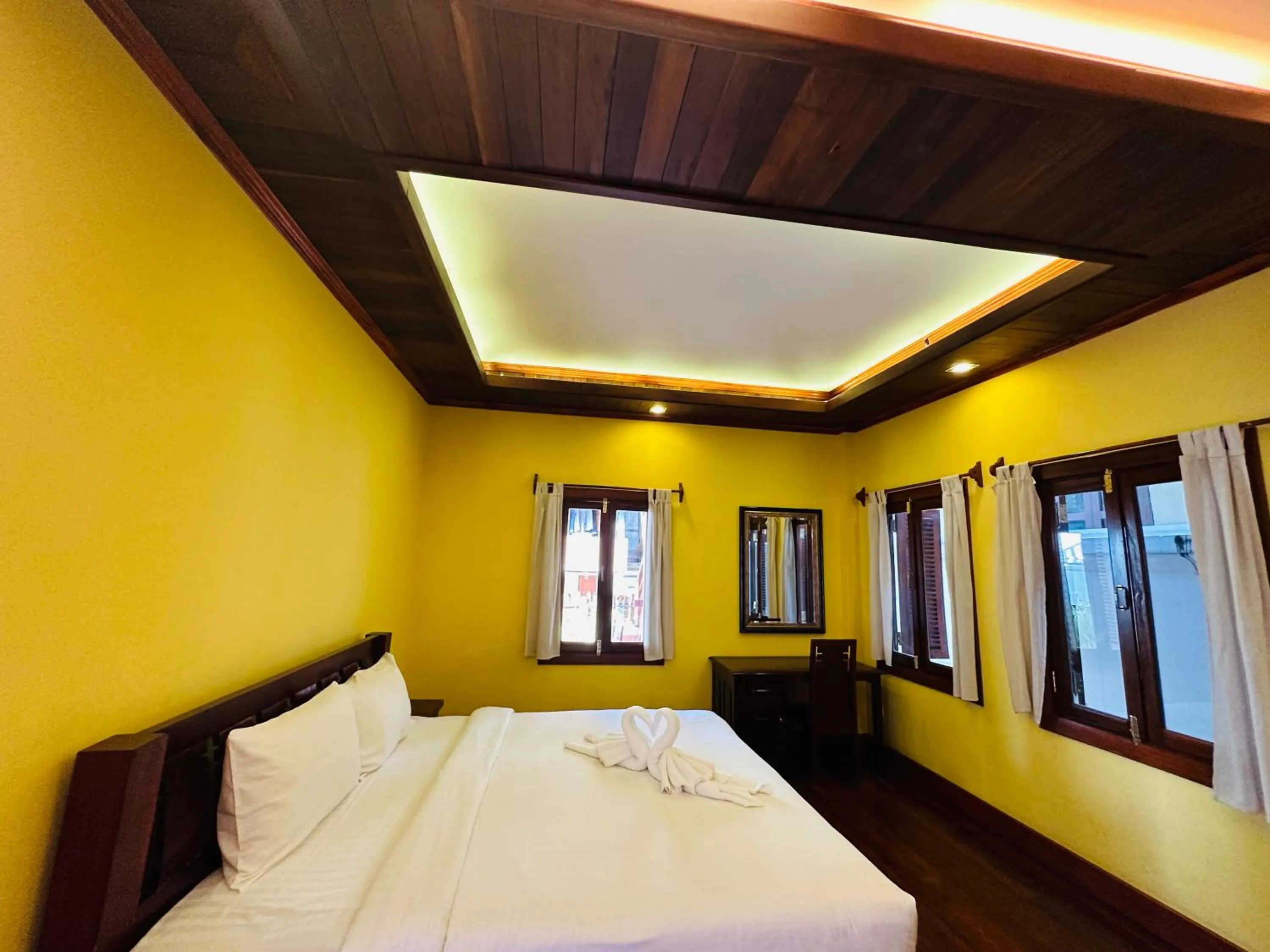 Bed in Villa Phonethip Mekong Riverside