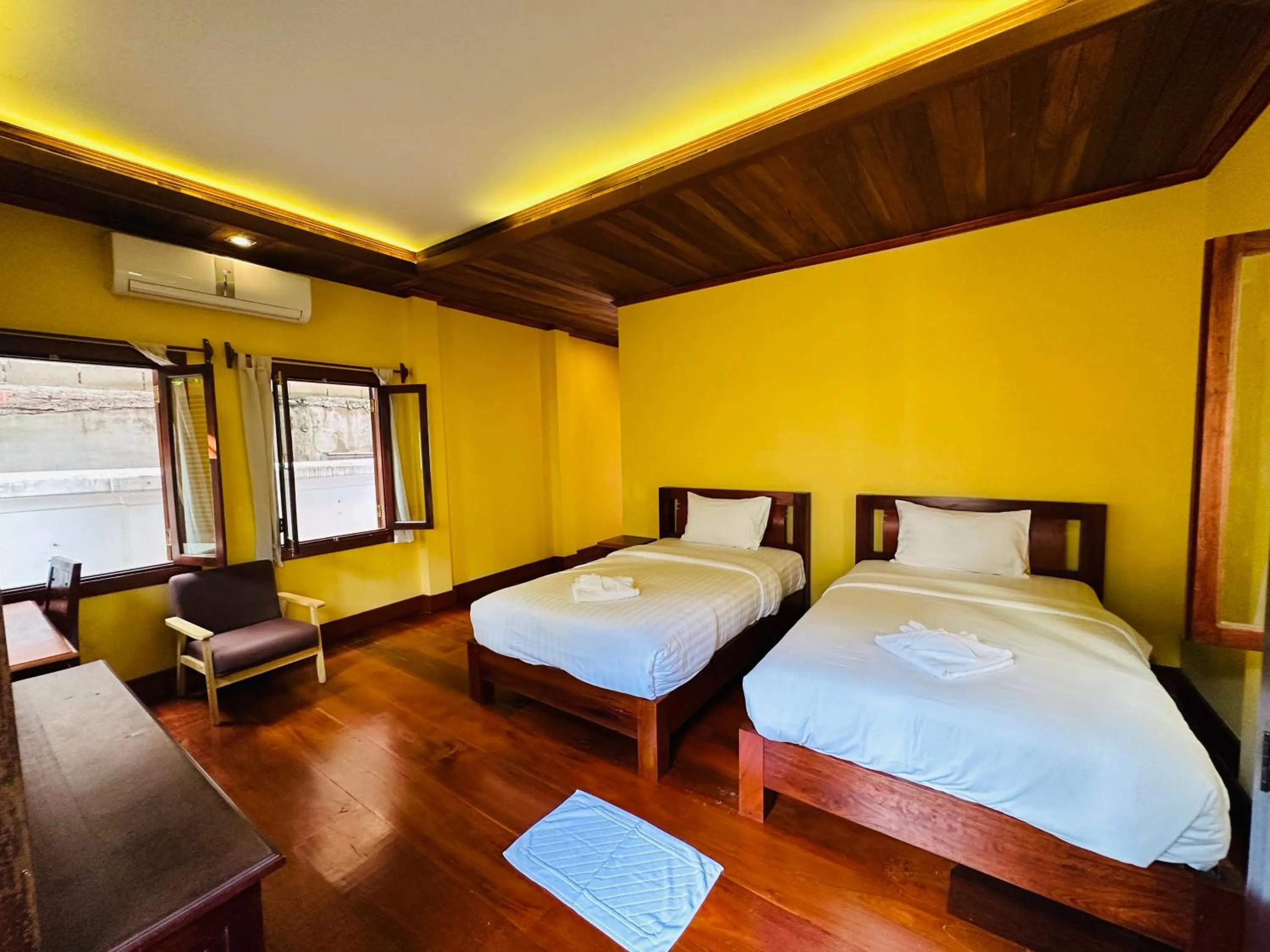 Bed in Villa Phonethip Mekong Riverside