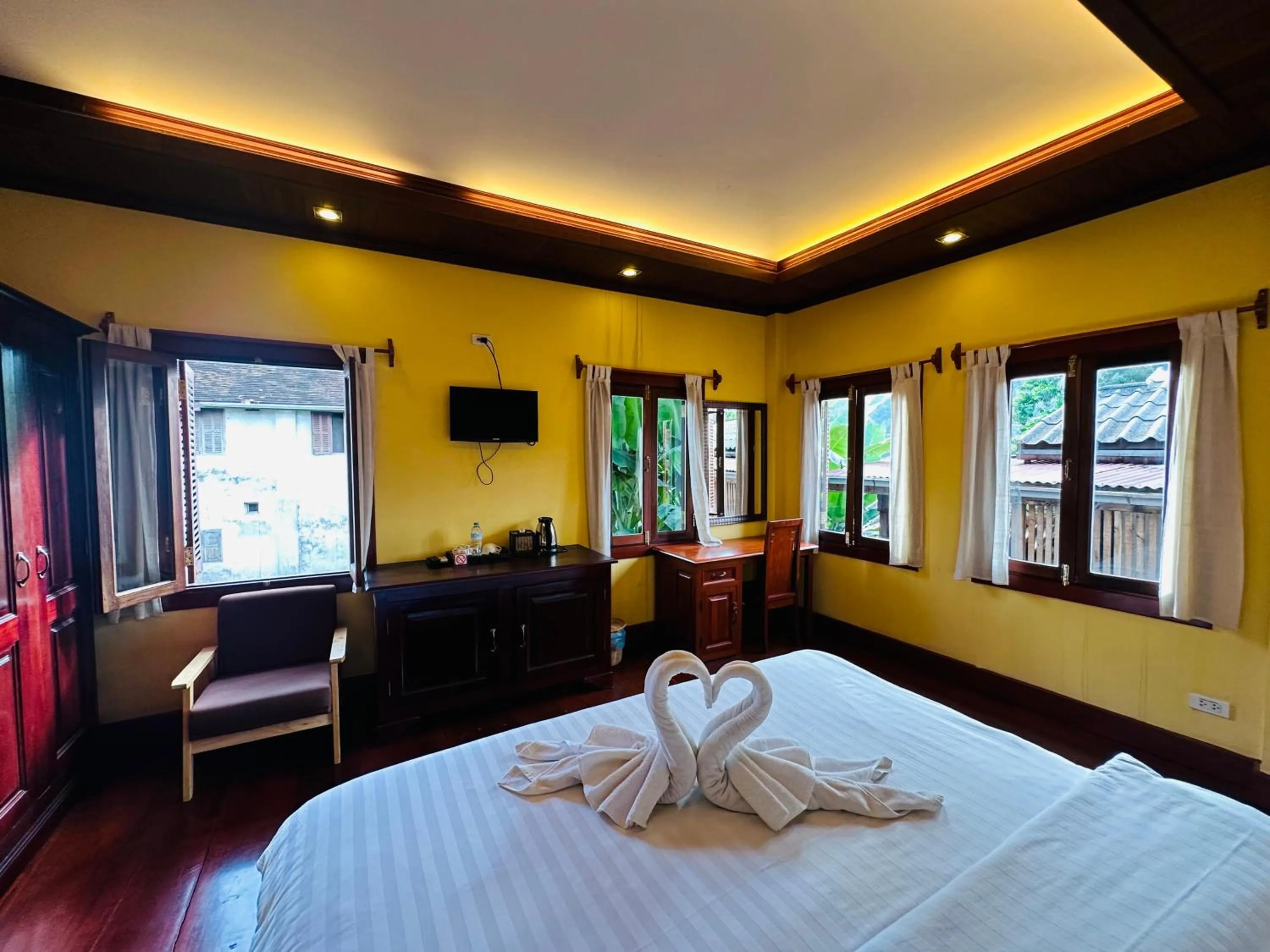 Bed in Villa Phonethip Mekong Riverside