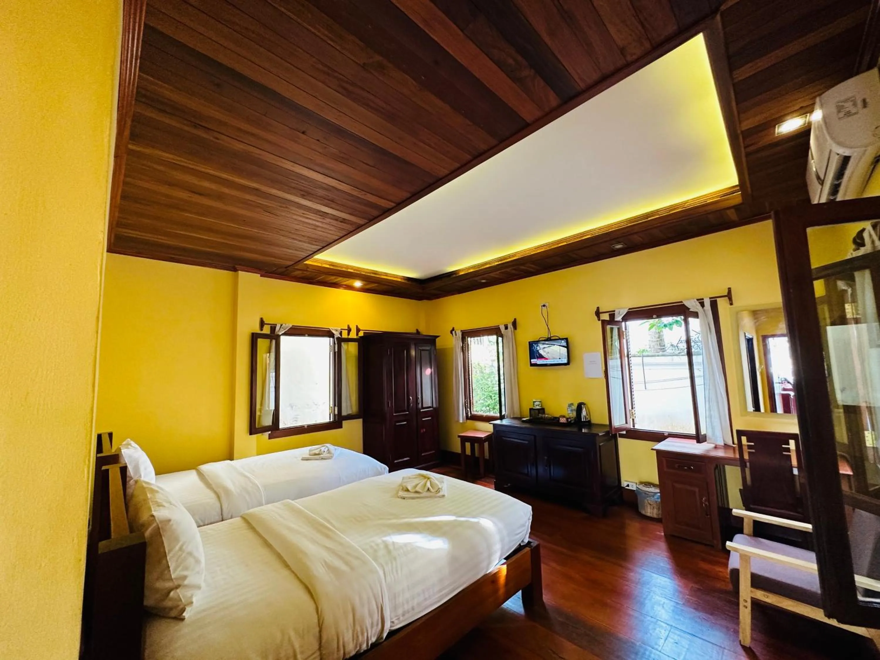 Bed in Villa Phonethip Mekong Riverside