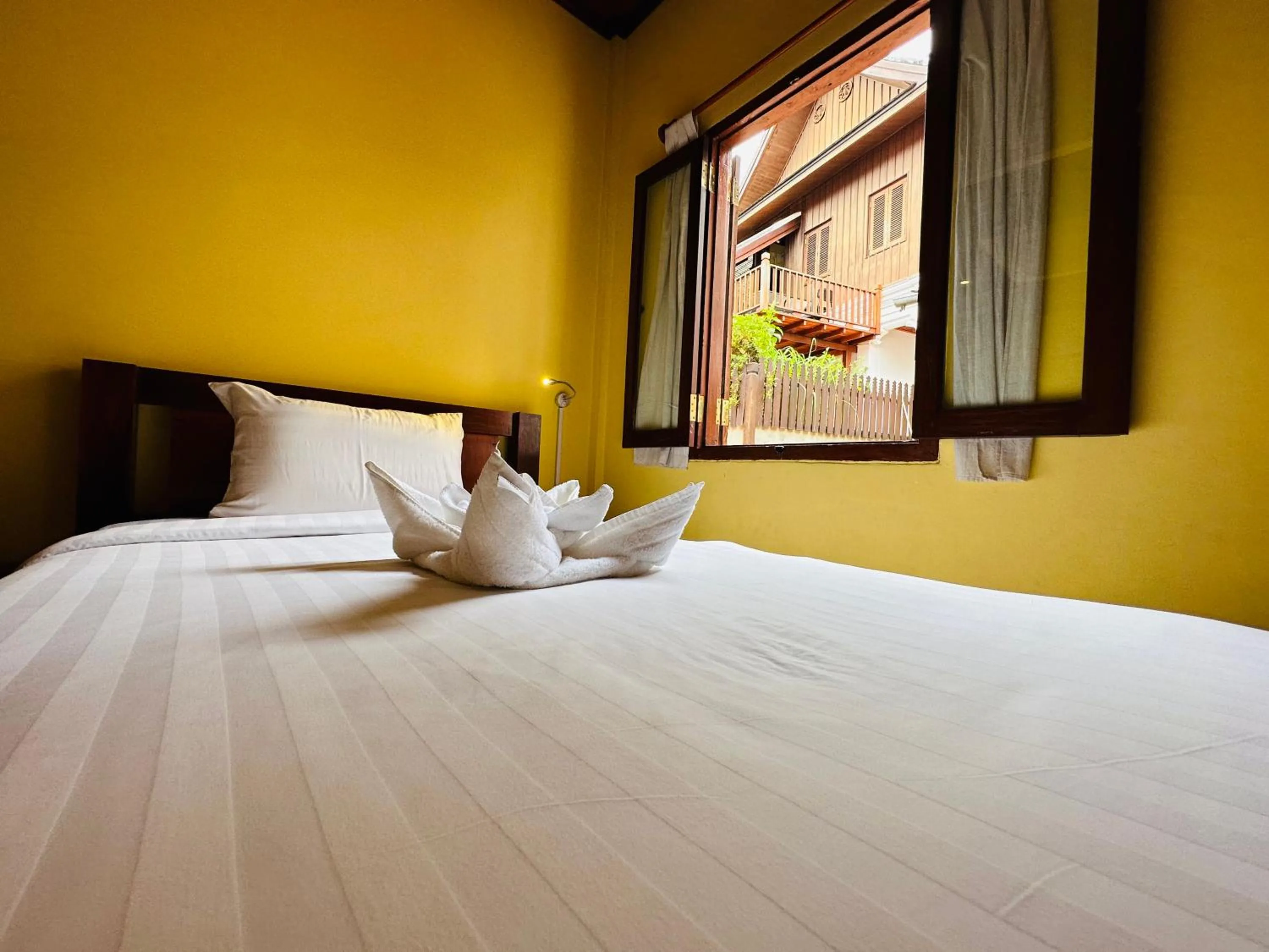 Bed in Villa Phonethip Mekong Riverside