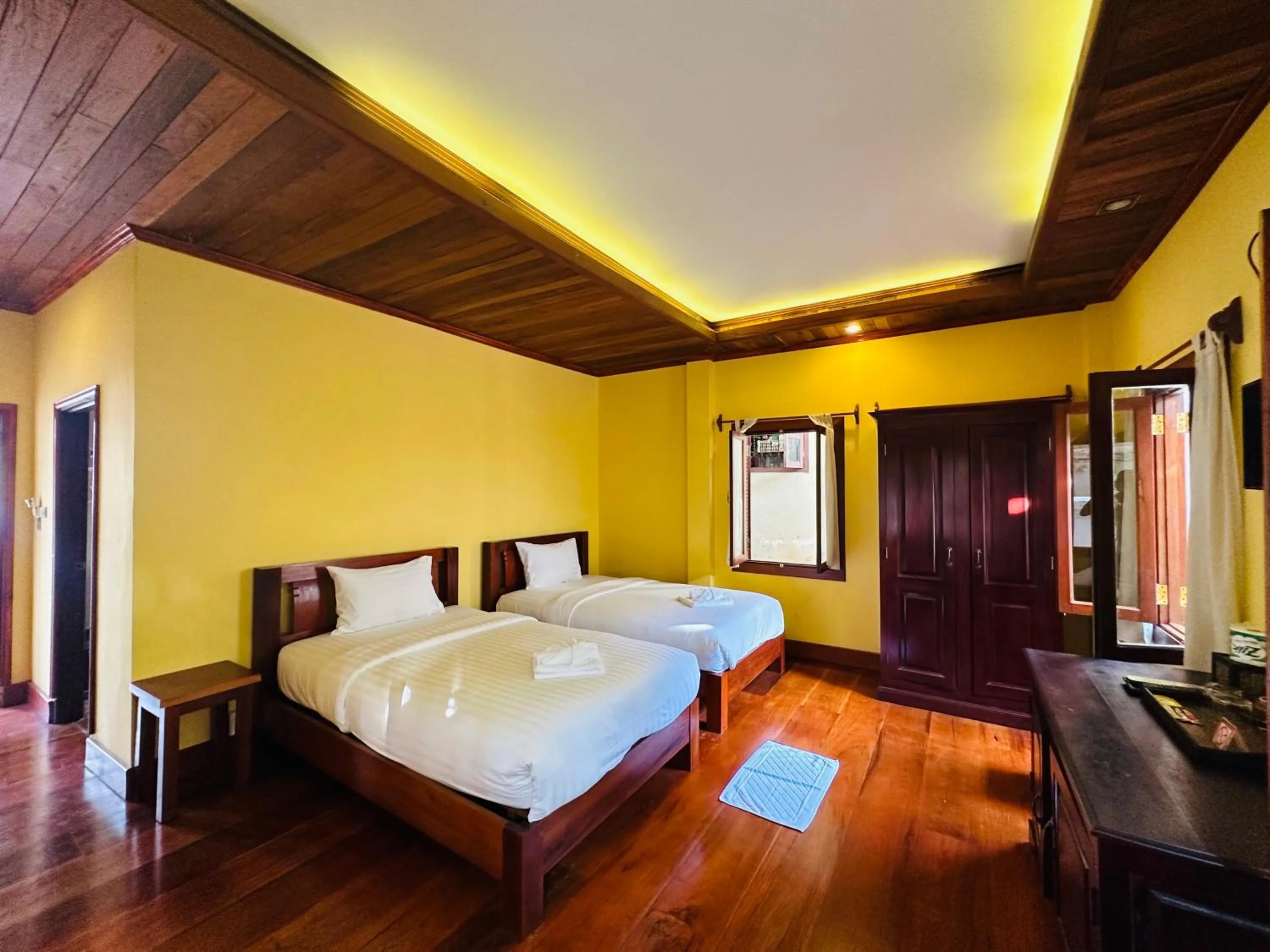 Bed in Villa Phonethip Mekong Riverside