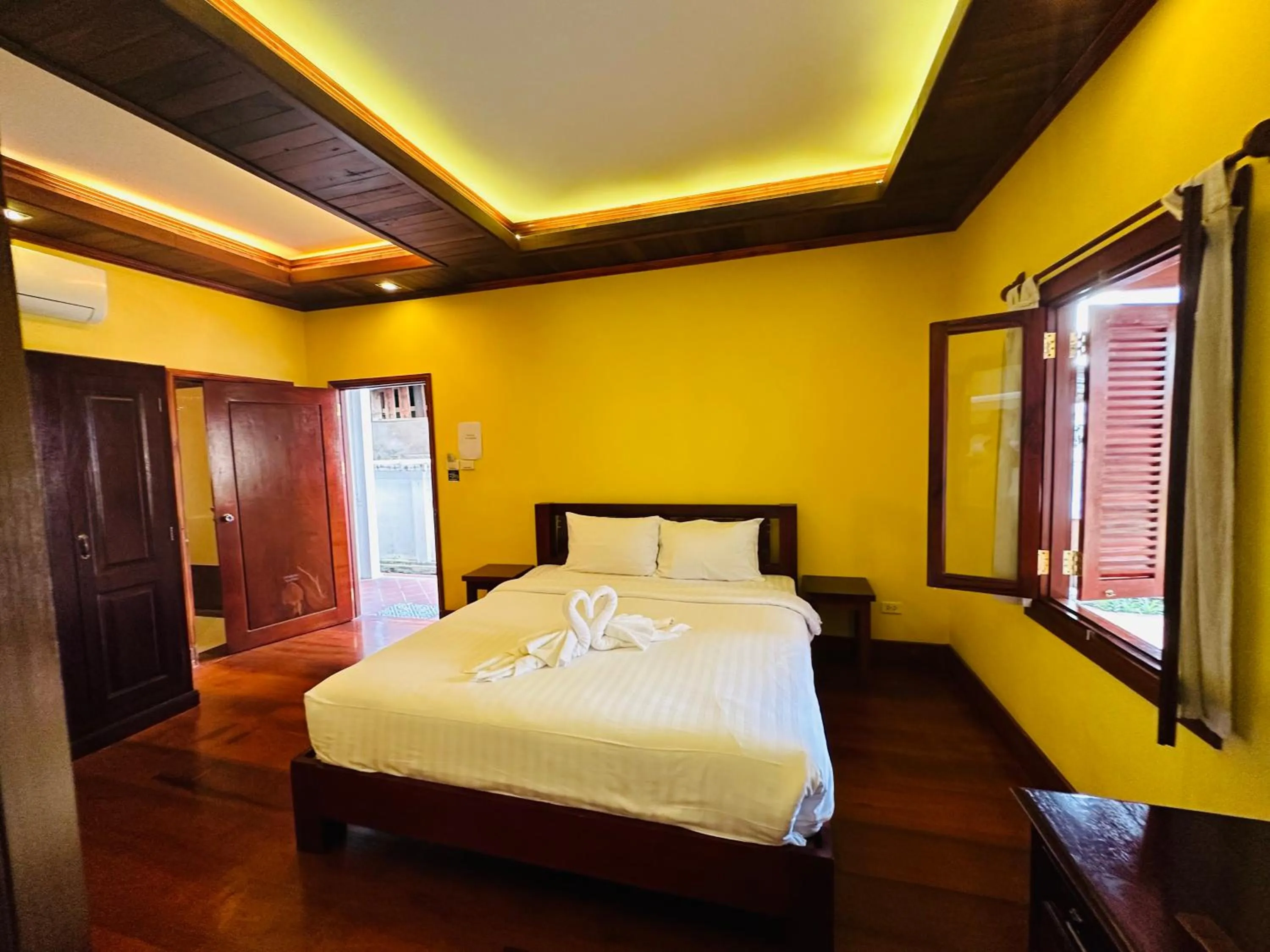 Bed in Villa Phonethip Mekong Riverside